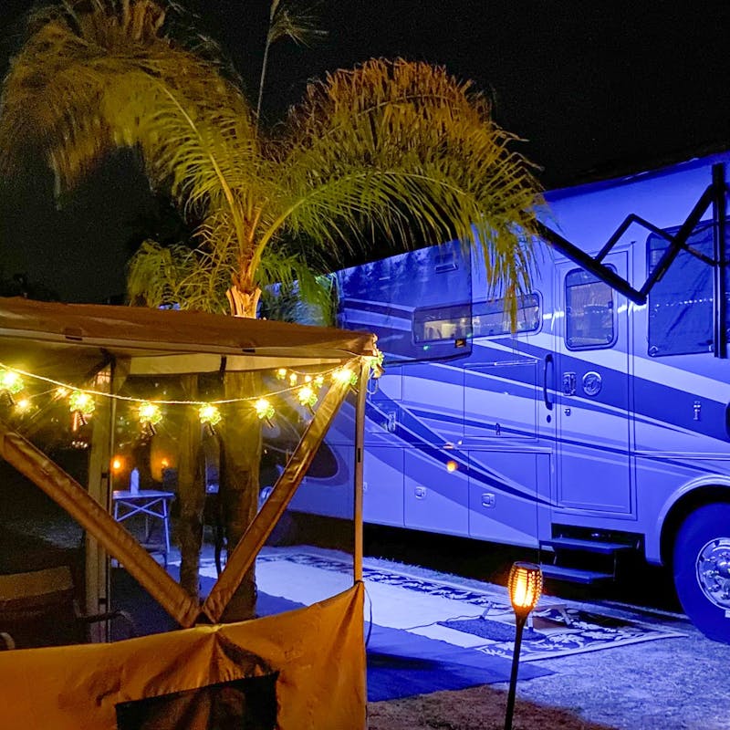 Michael & Tiffany Dunagan's RV parked at night at a beach campsite