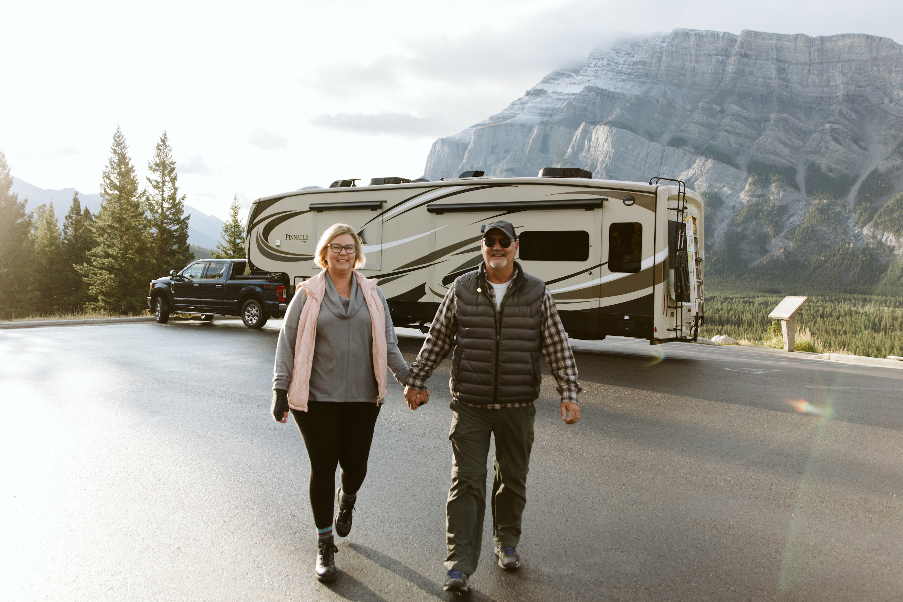 Tina and Craig walking around a campground together. 