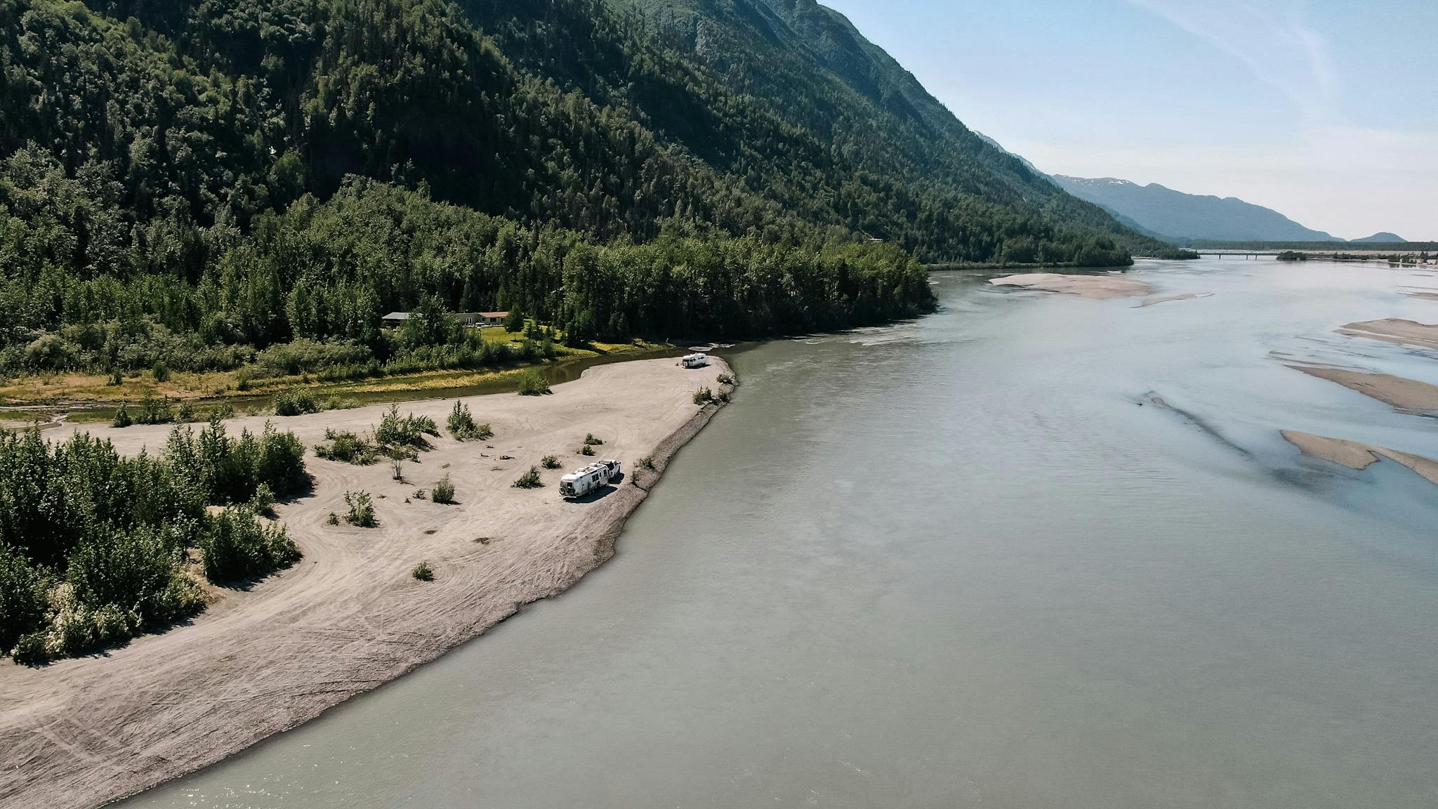 An aerial view of Karen Blue's RV parked alongside a lake 