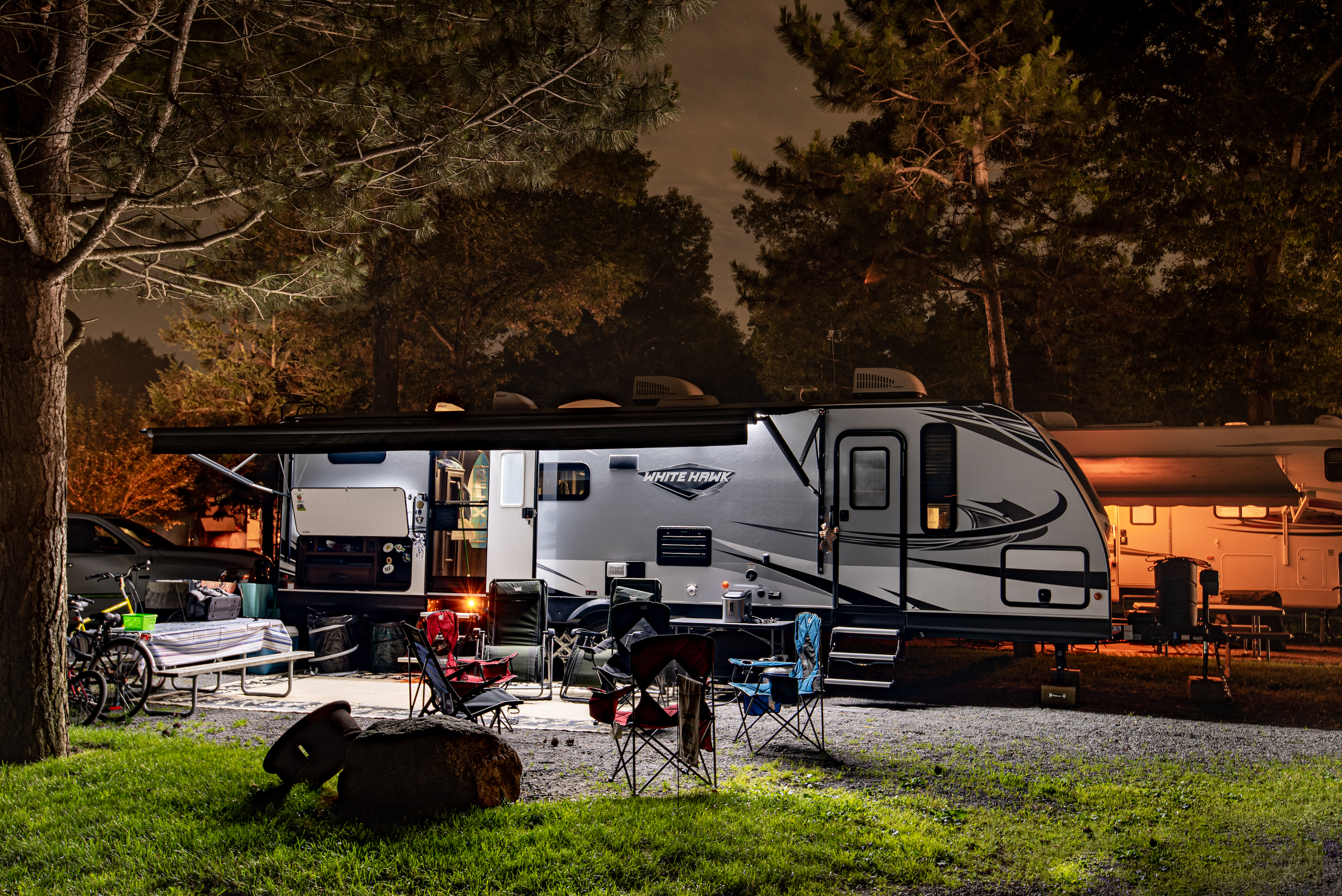Bill Sferrazza's Jayco RV parked at night at a campsite.