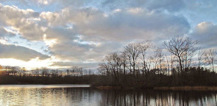 A serene lake at during sunrise at Punderson State Park and Geauga Park District, Geauga County, Ohio.