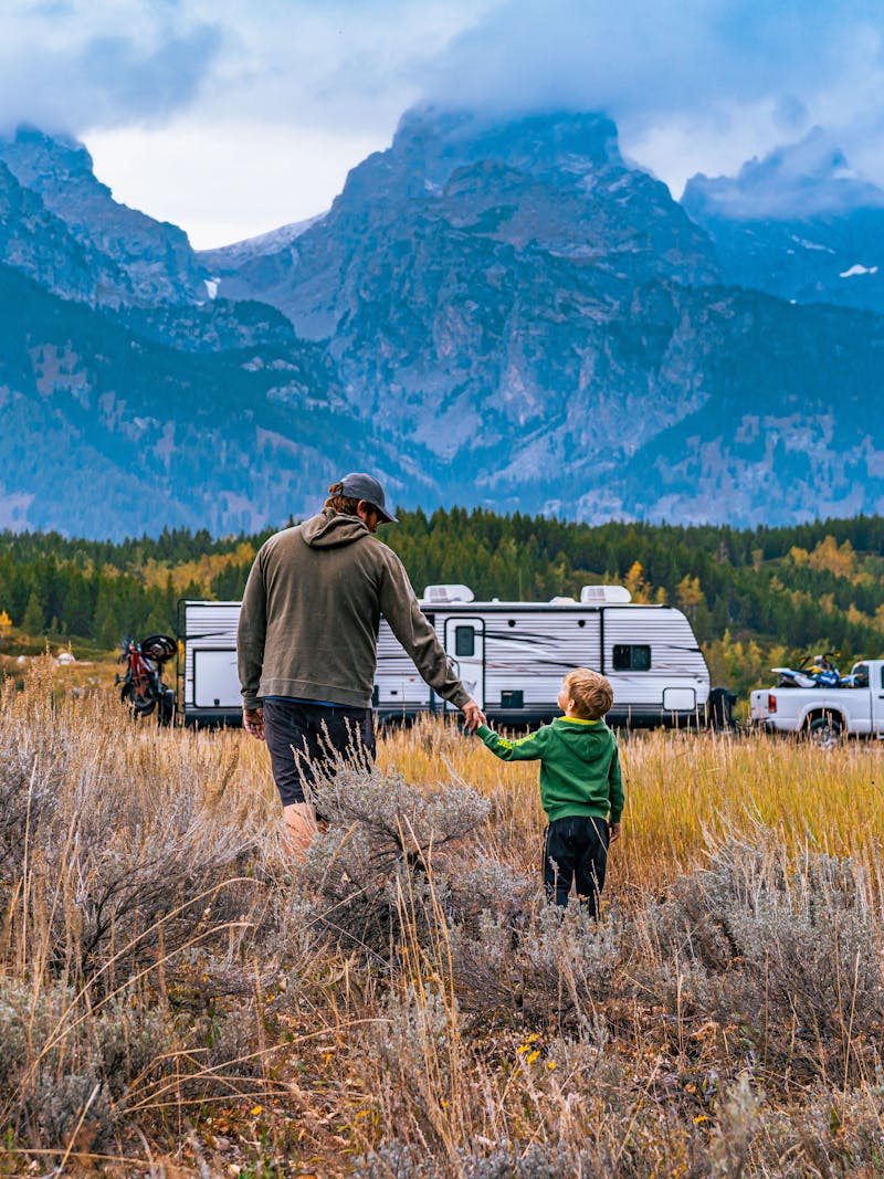 The Tilby family with their Jayco Jay Flight Travel Trailer in the mountains