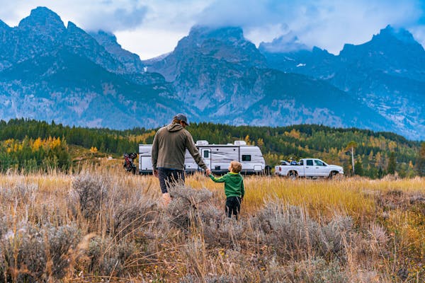 The Tilby family with their Jayco Jay Flight Travel Trailer in the mountains
