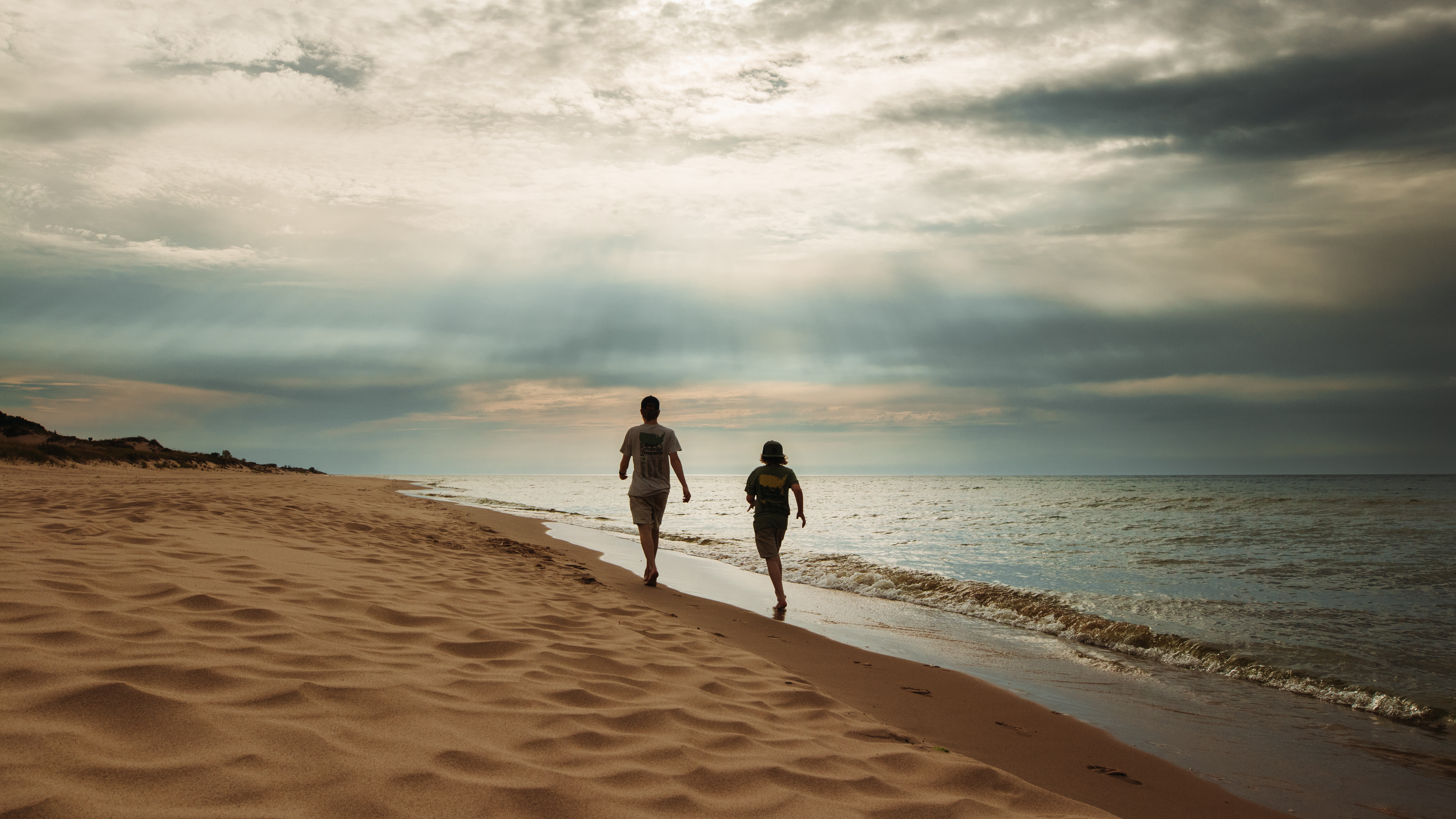 Andy and Kris Murphy's kids walking on the Lake Michigan lakeshore at Huron-Manistee National Forest 