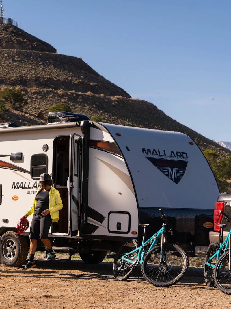 Britt and Brooke getting ready to go on a mountain bike ride outside of their RV