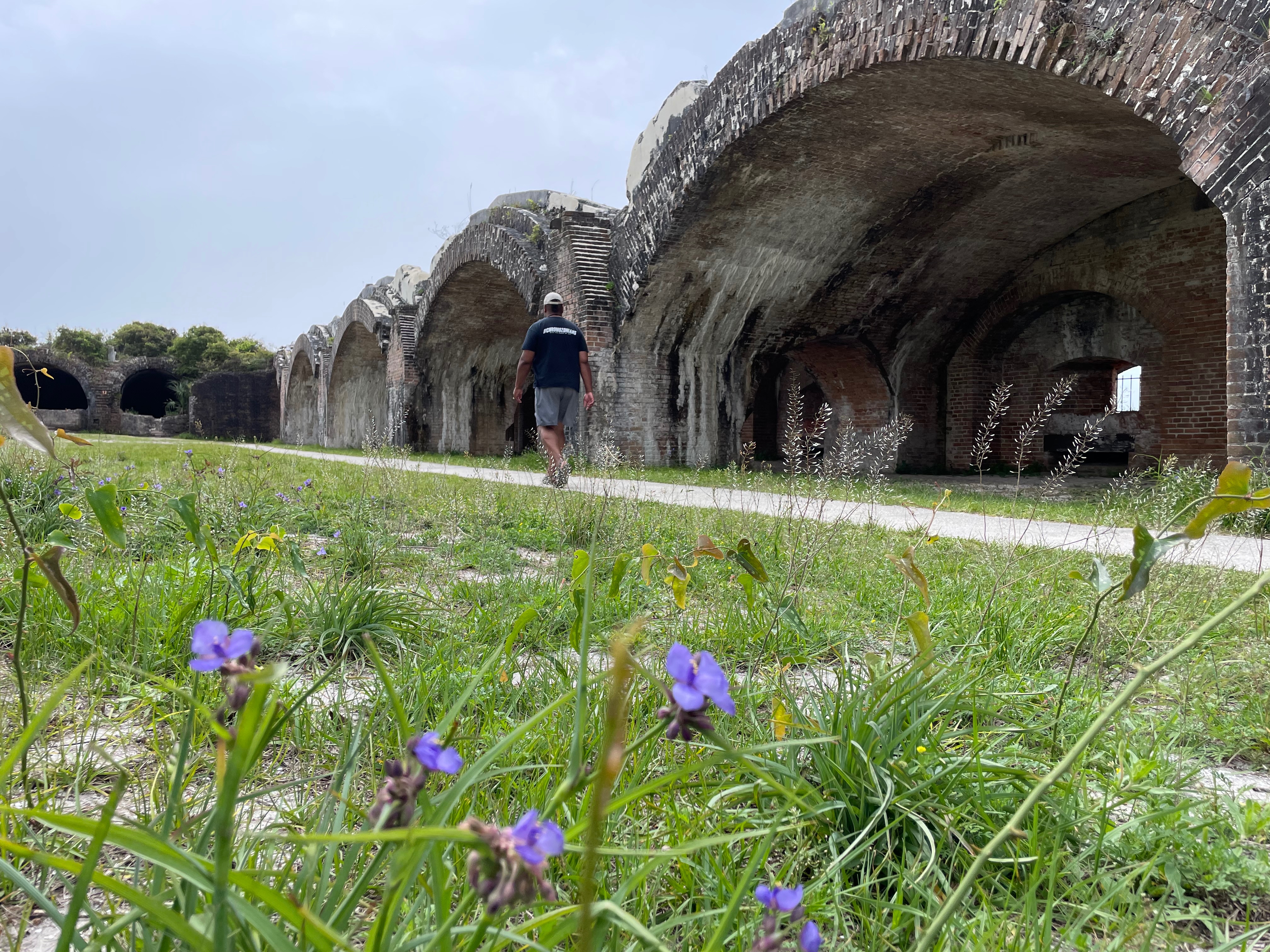 Ben McMillan walking around Fort Pickens