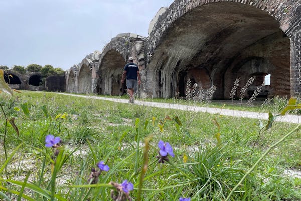 Ben McMillan walking around Fort Pickens
