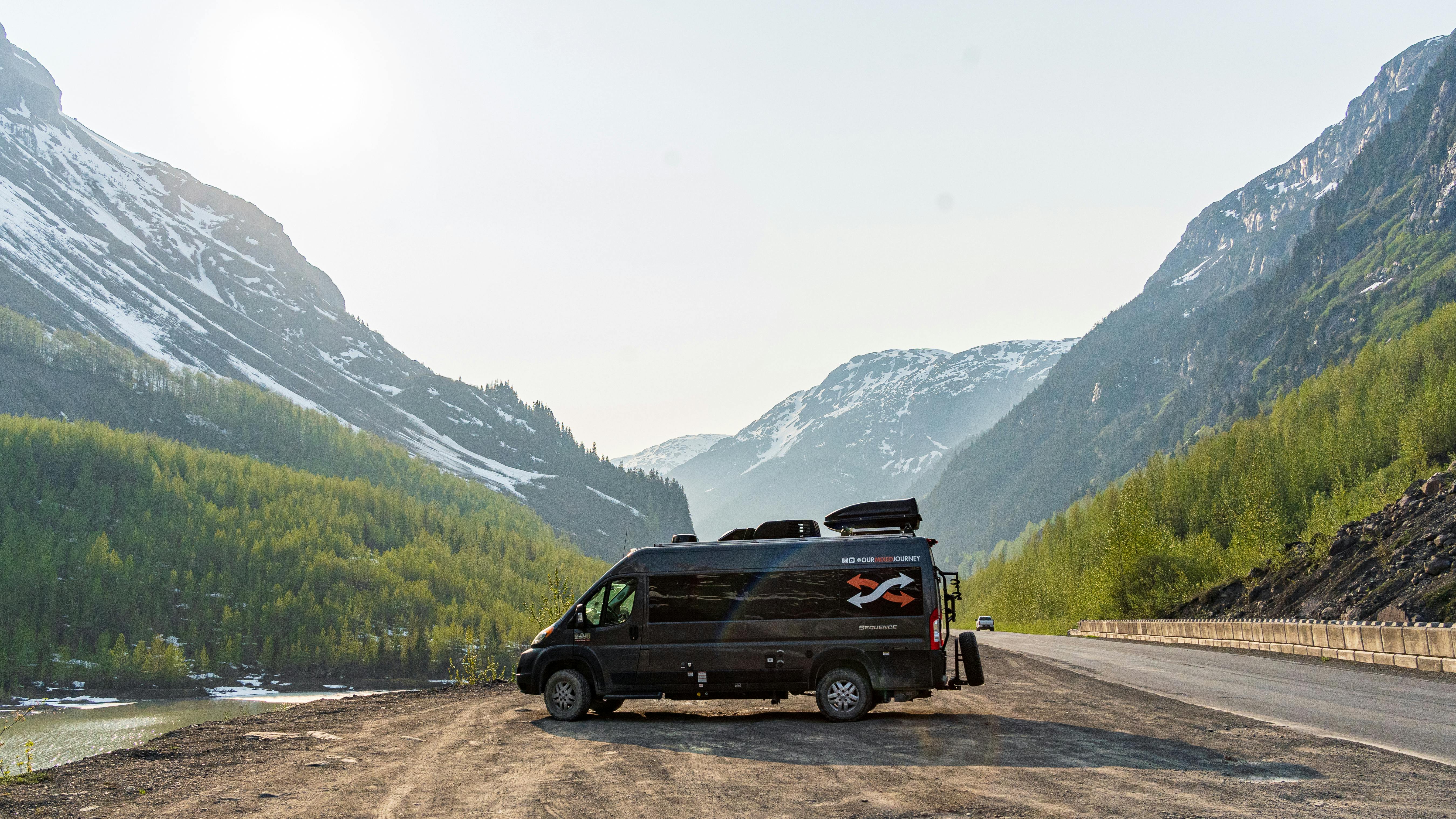 Gabe and Rocio Rivero's campervan parked in front of a beautiful mountain valley 