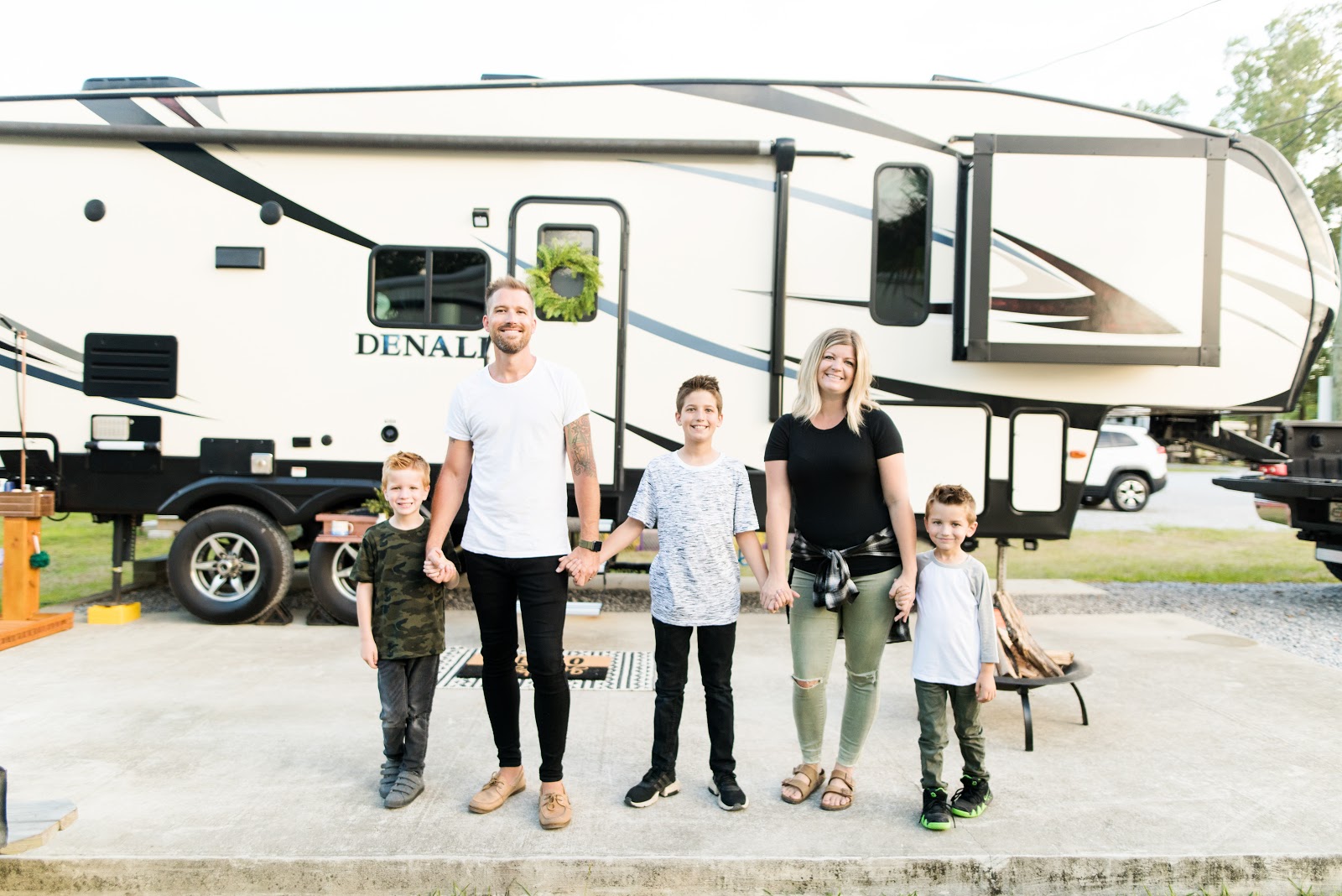 The Cutler family posed in front of their RV for a portrait. 