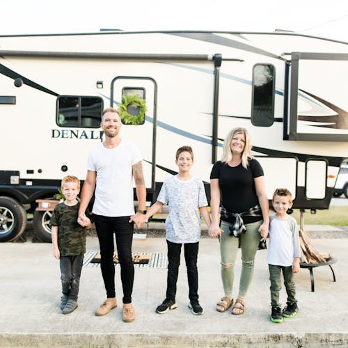 The Cutler family posed in front of their RV for a portrait.