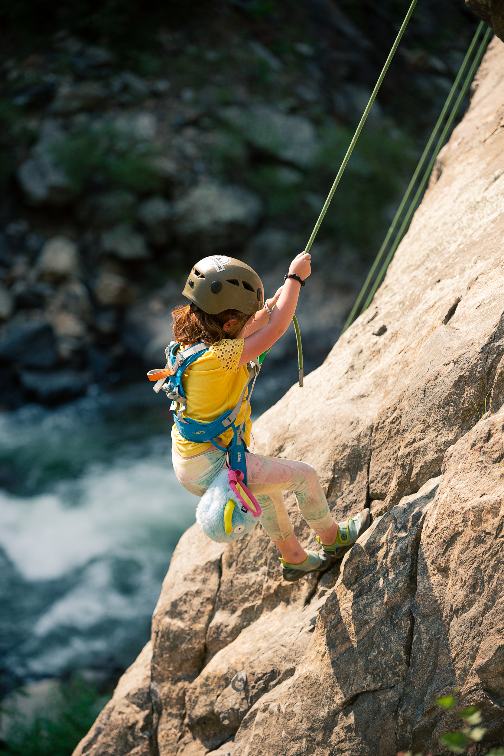 Ila Roberson coming down the side of a rockwall. 