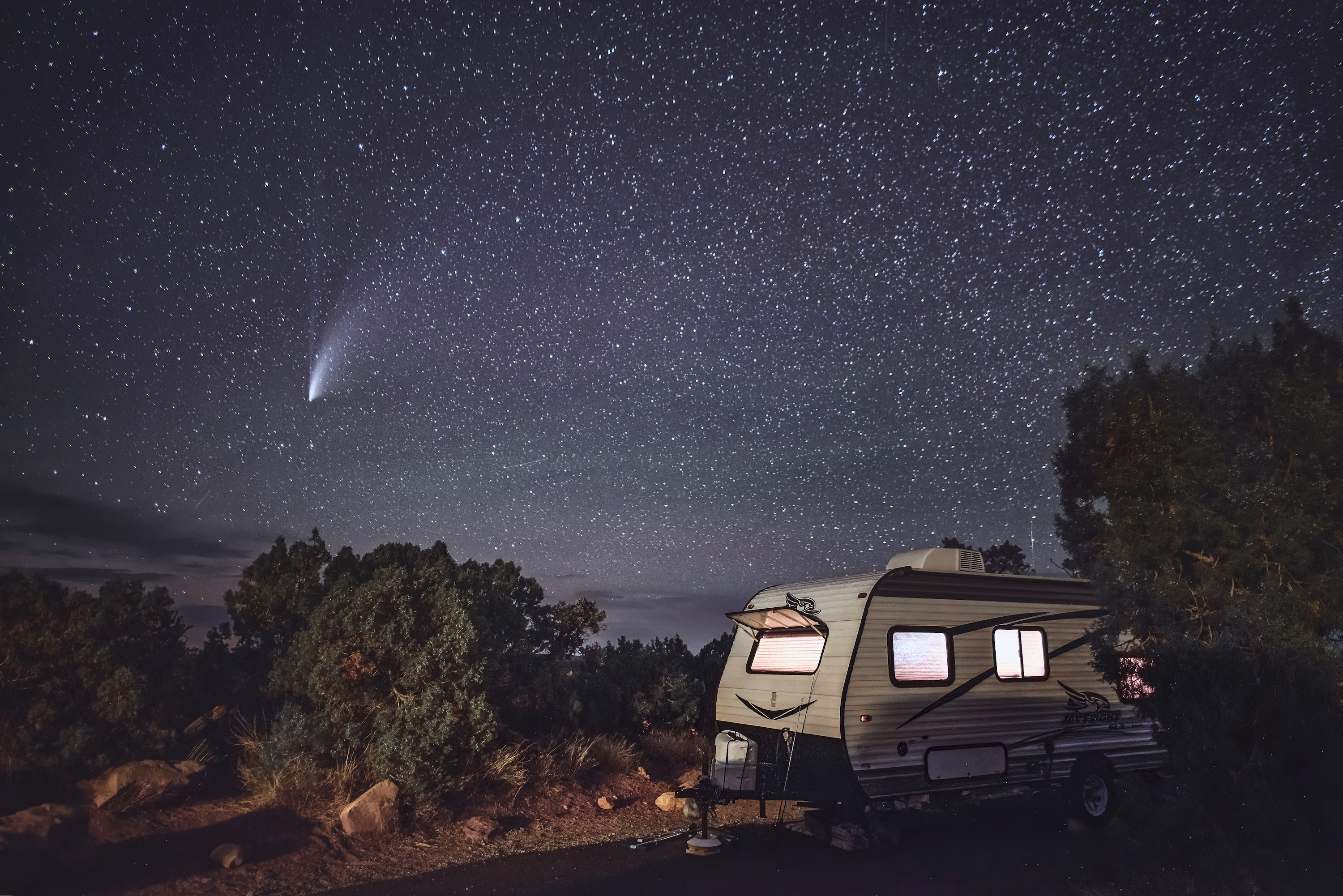 the NEOWISE comet flashes through the sky with Alison Takacs's Jayco RV in the foreground.