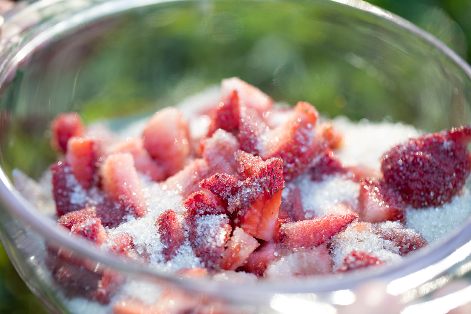 Chopped strawberries coated in sugar.