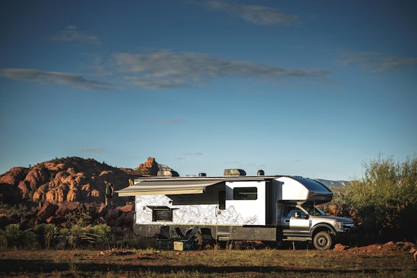The exterior of a Jayco Seneca Super C (Class C motorhome) parked in a desert landscape