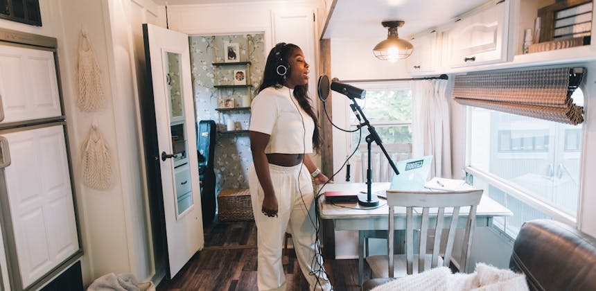 Jessy singing and recording a song inside her Keystone Cougar