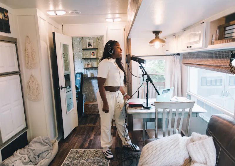Jessy singing and recording a song inside her Keystone Cougar