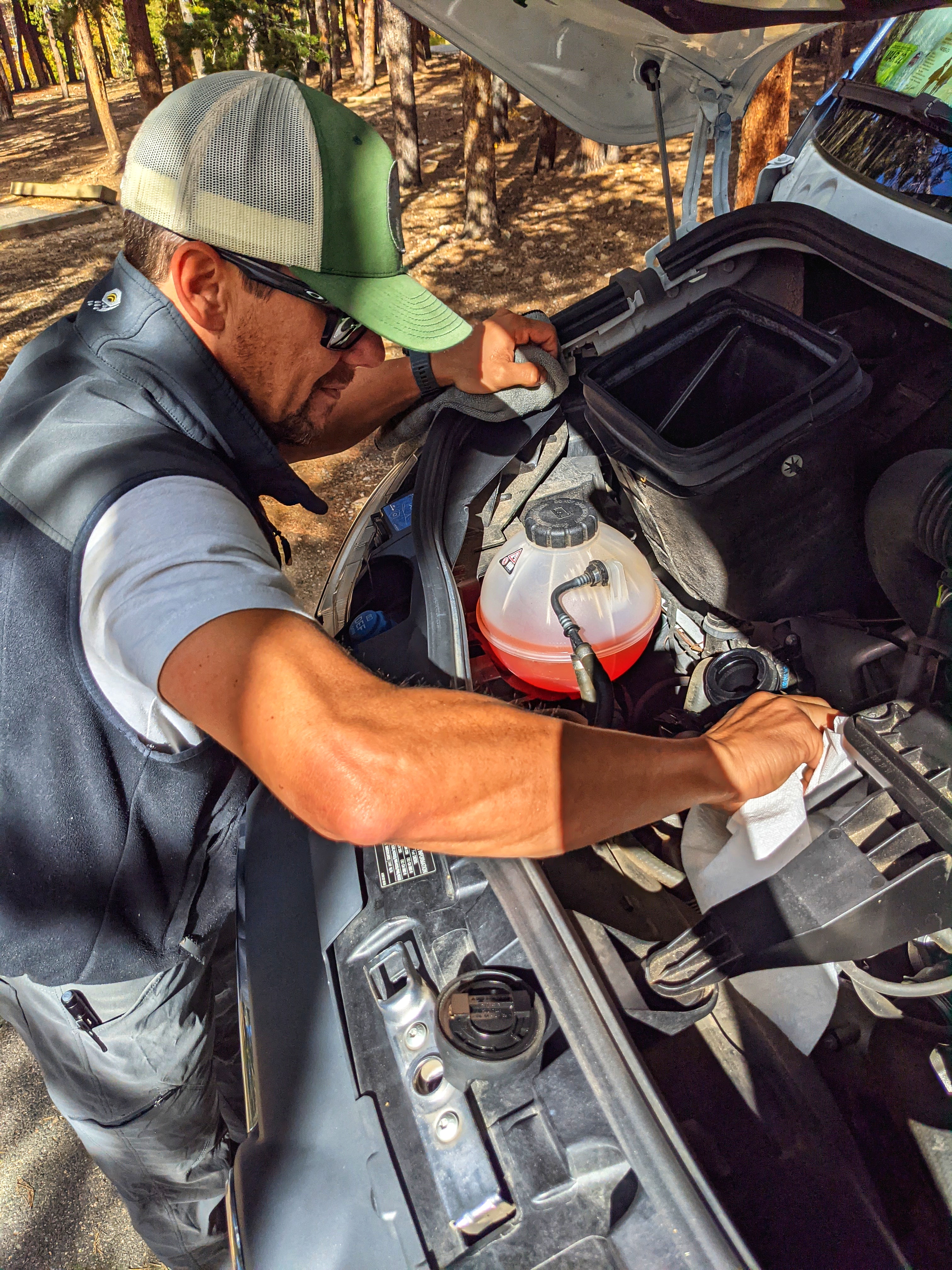 Dustin Bauer wiping down the hood of his Tiffin Wayfarer