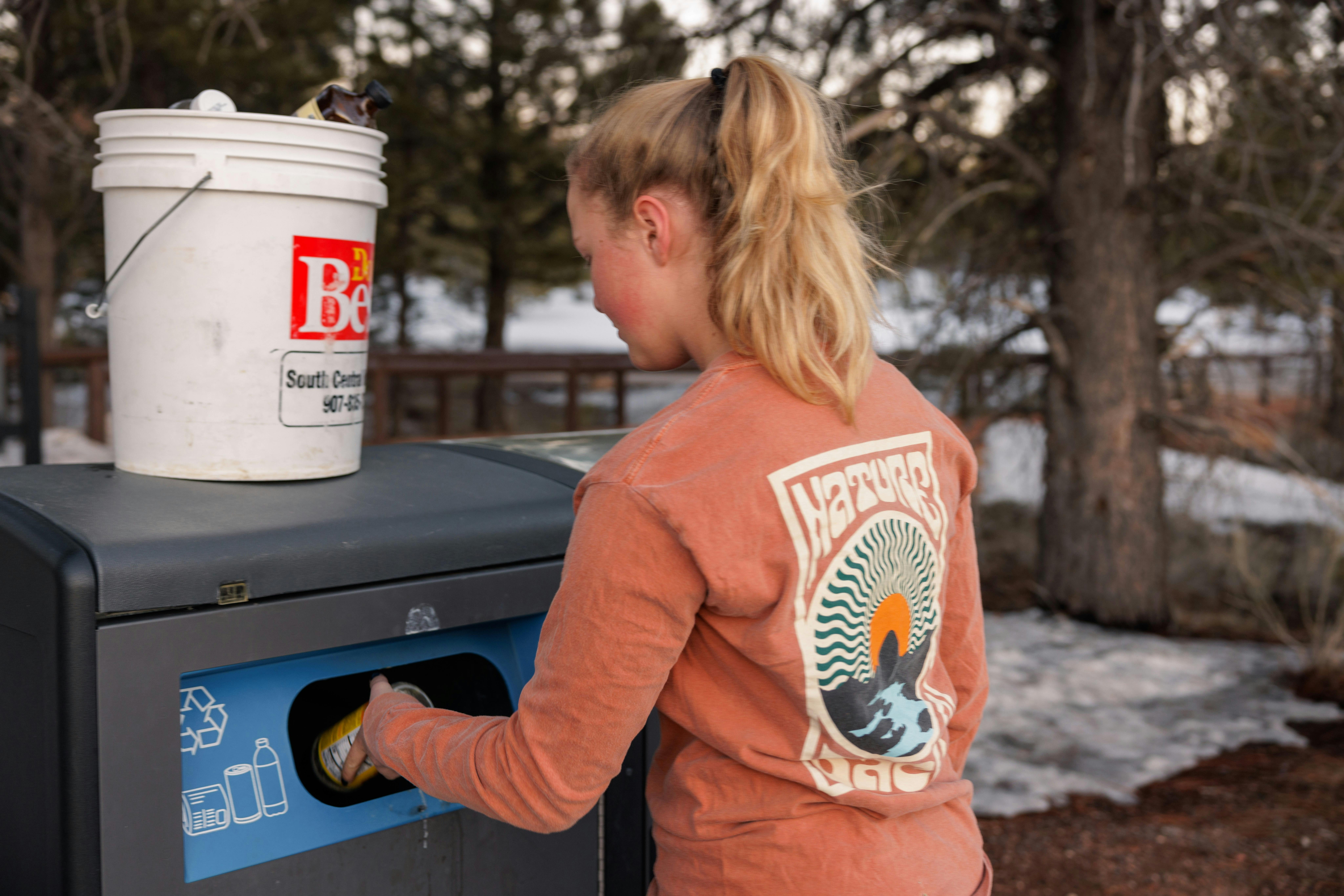 Karen Blue's daughter recycling at a campground