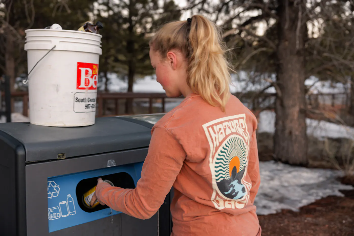 Karen Blue's daughter recycling at a campground