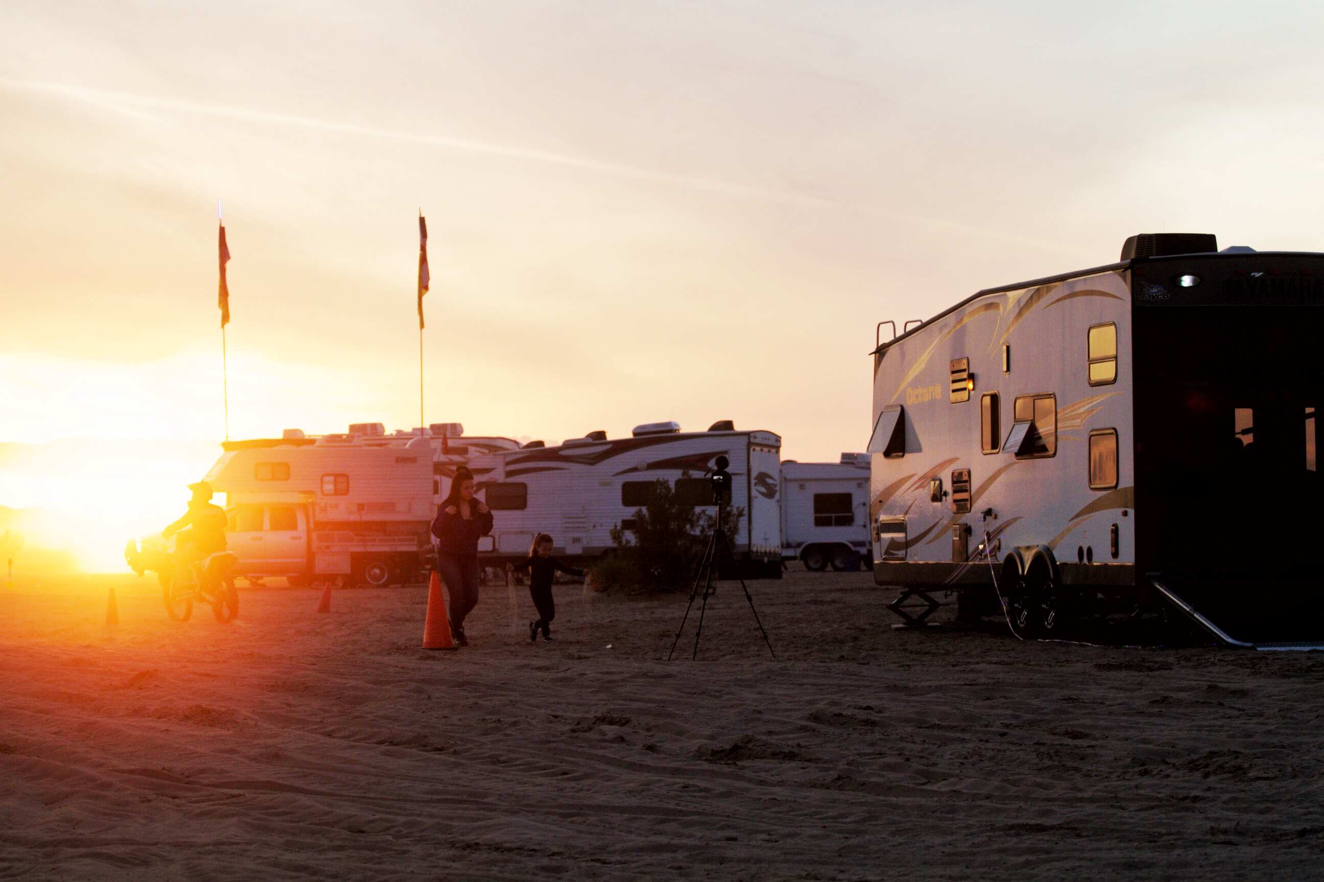 The sun setting over RVs parked at Glamis.