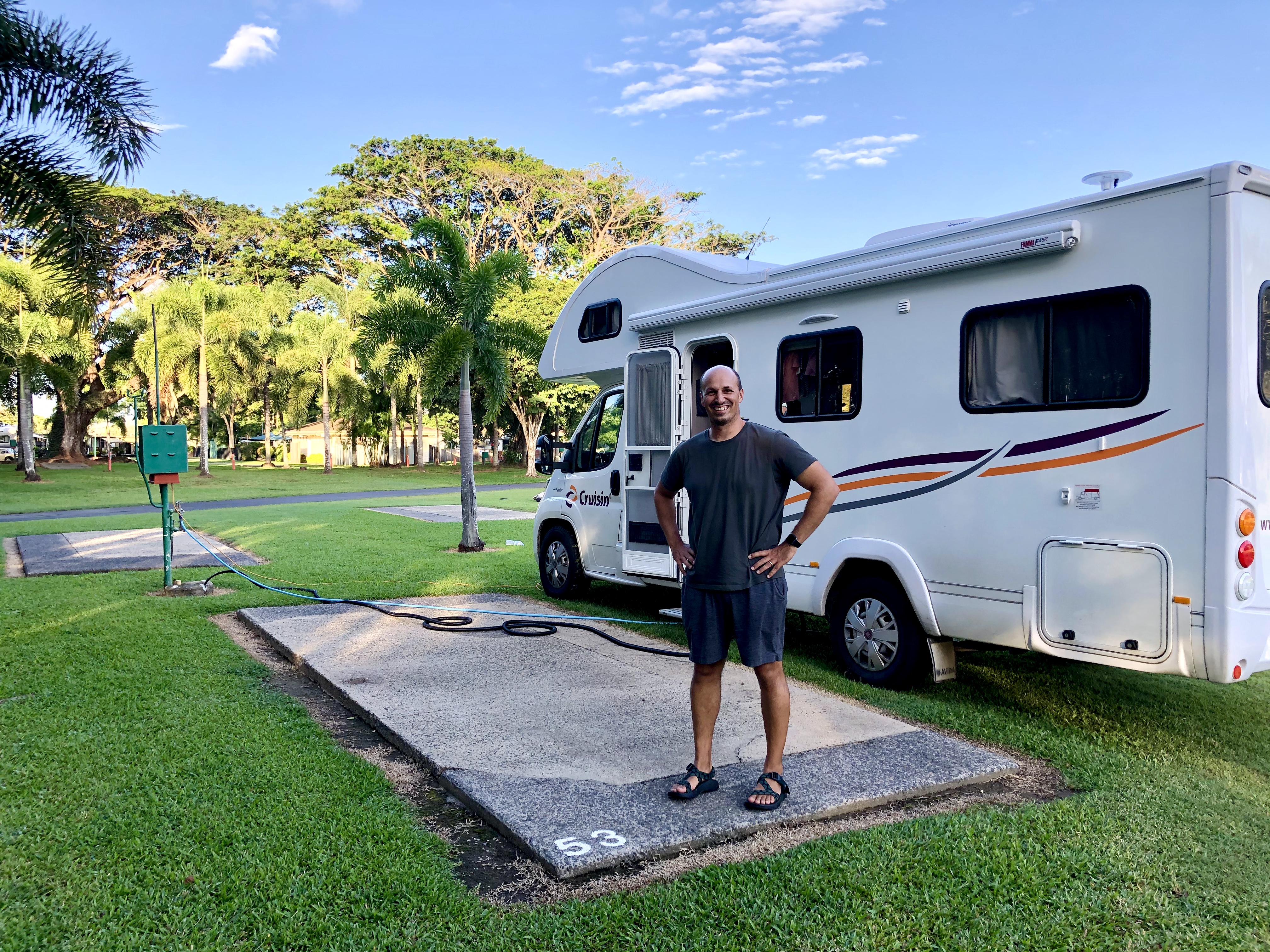 LAURA GEORGIEFF's husband standing in front of a rented Class C RV