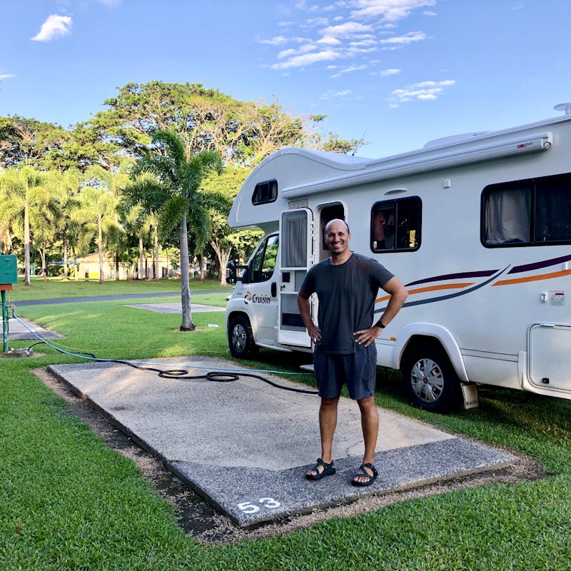 LAURA GEORGIEFF's husband standing in front of a rented Class C RV