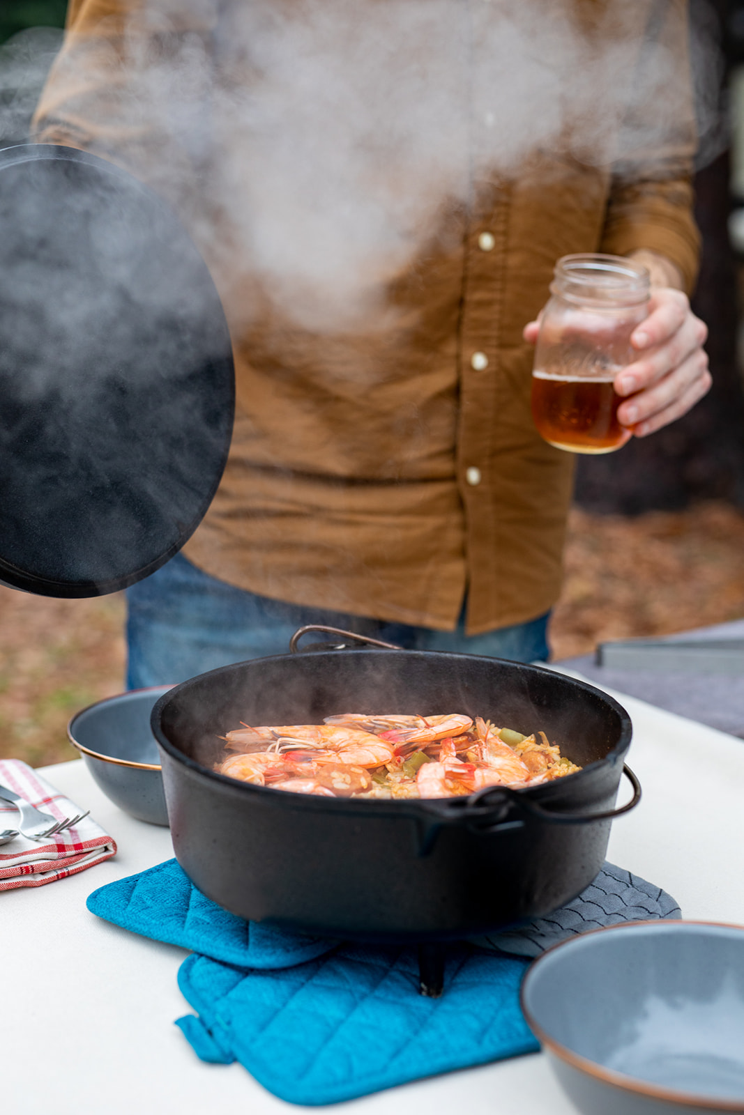 A steaming pot of jambalaya on a table. 
