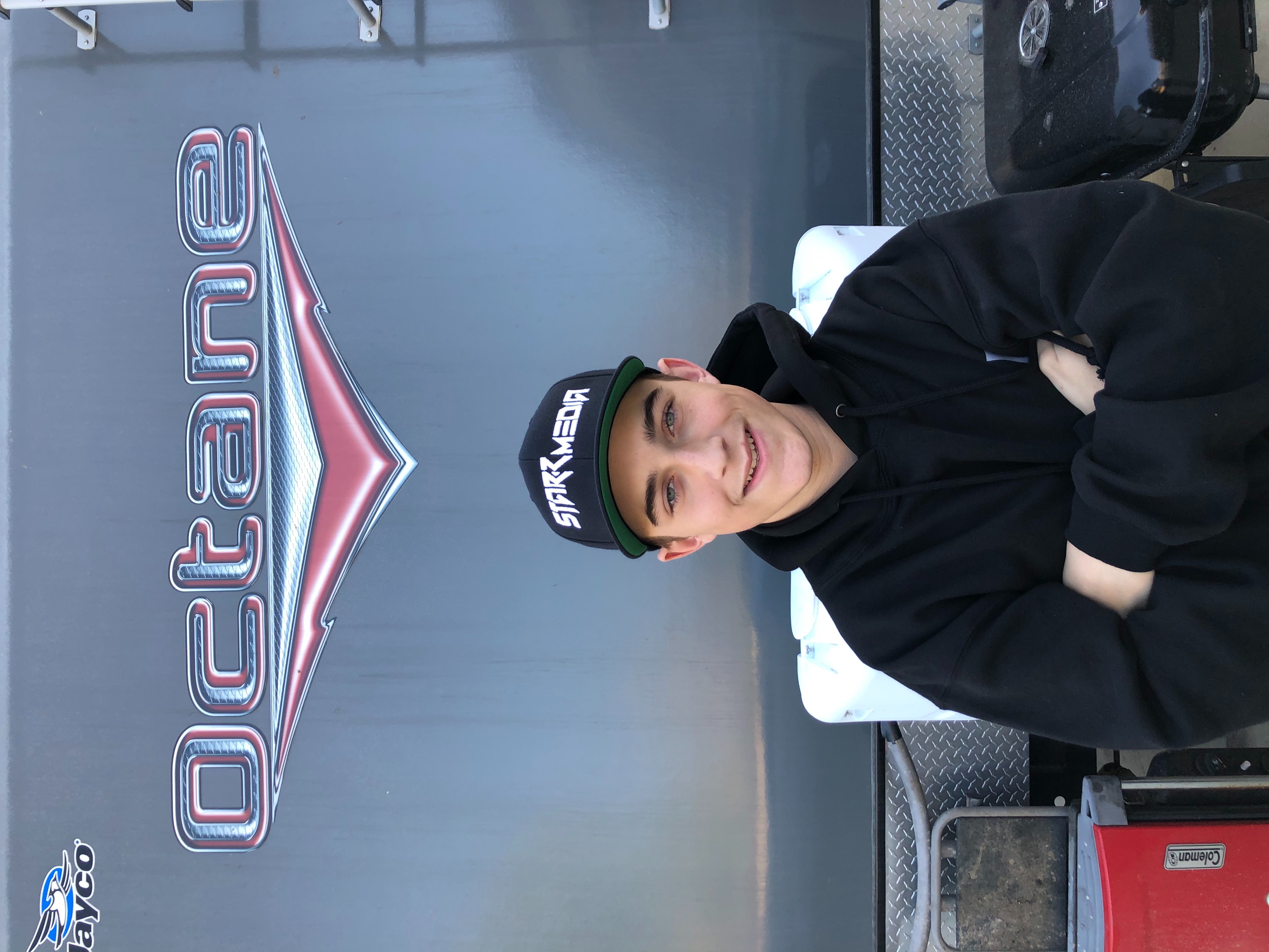 A headshot of Taylor Walsh in front of his family's Jayco RV.