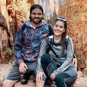 Jason Anderon and Dawn Robbins posing for a picture in the mountains.