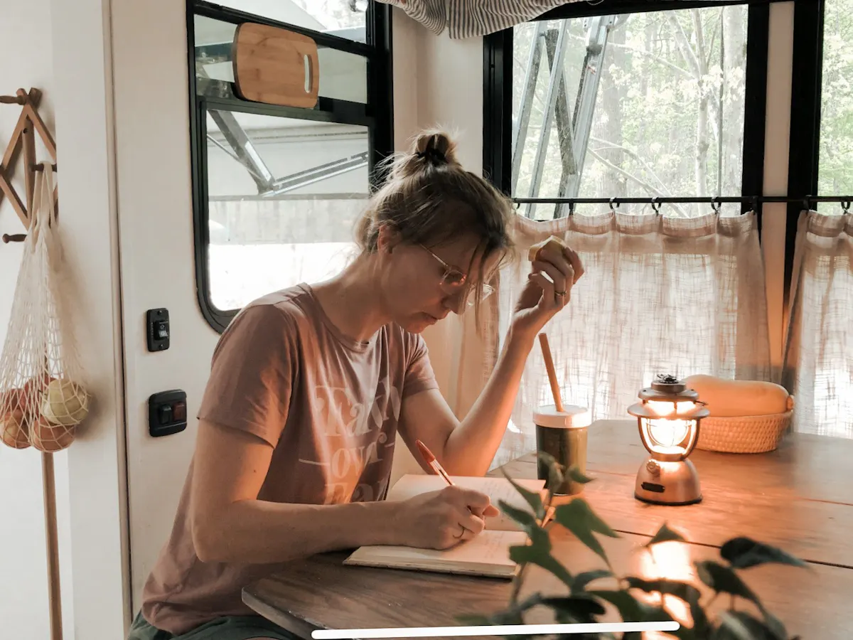 Bibi BARRINGER writing in her self care journal