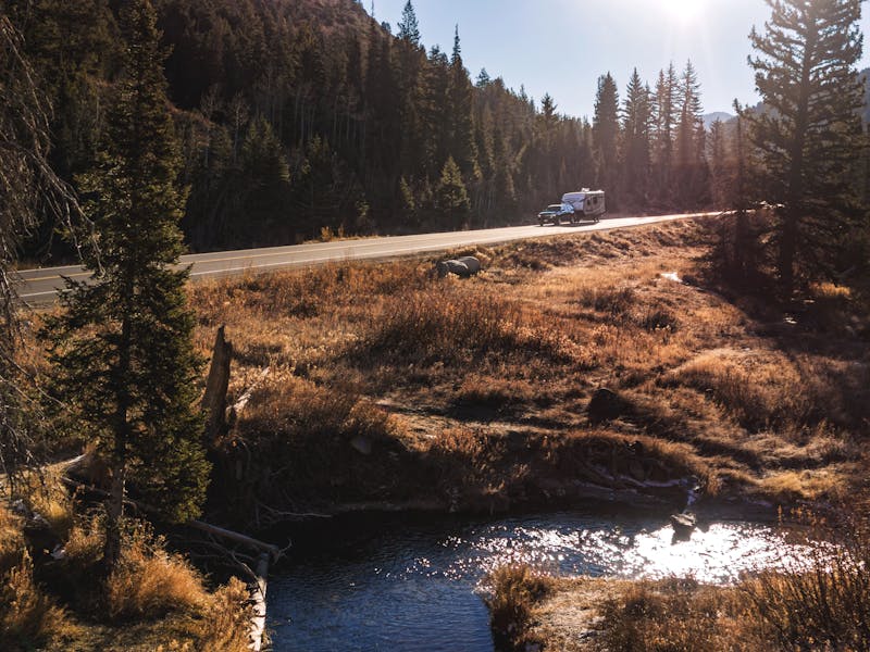 Jayco Starcraft Super Lite driving through a National Forest