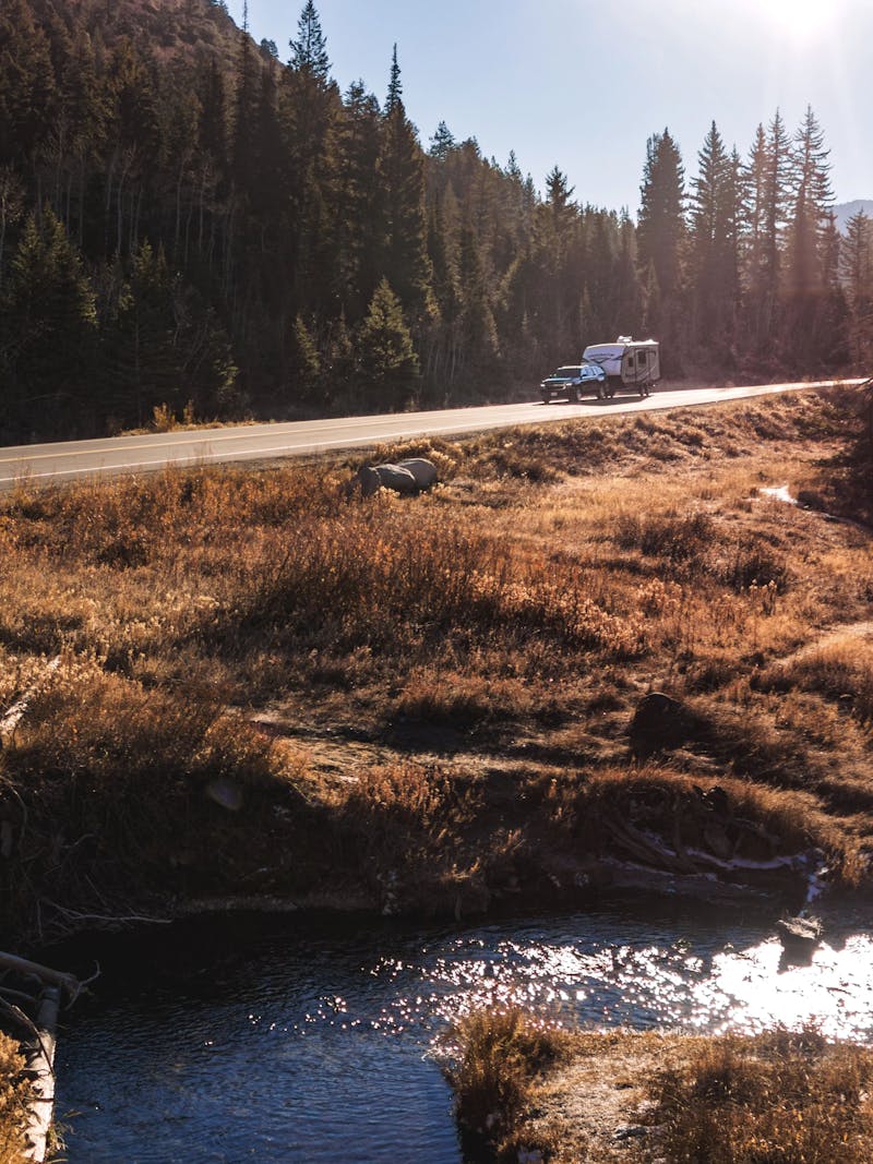 Jayco Starcraft Super Lite driving through a National Forest