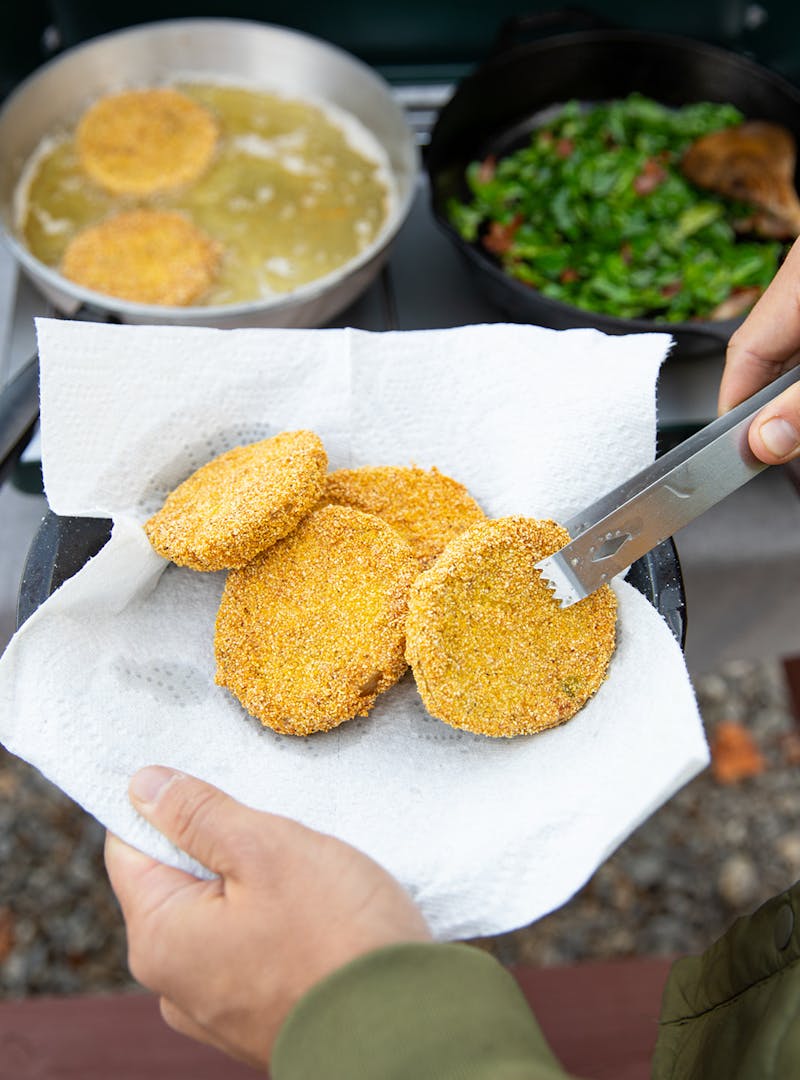 Fried green tomatoes out of the fryer.