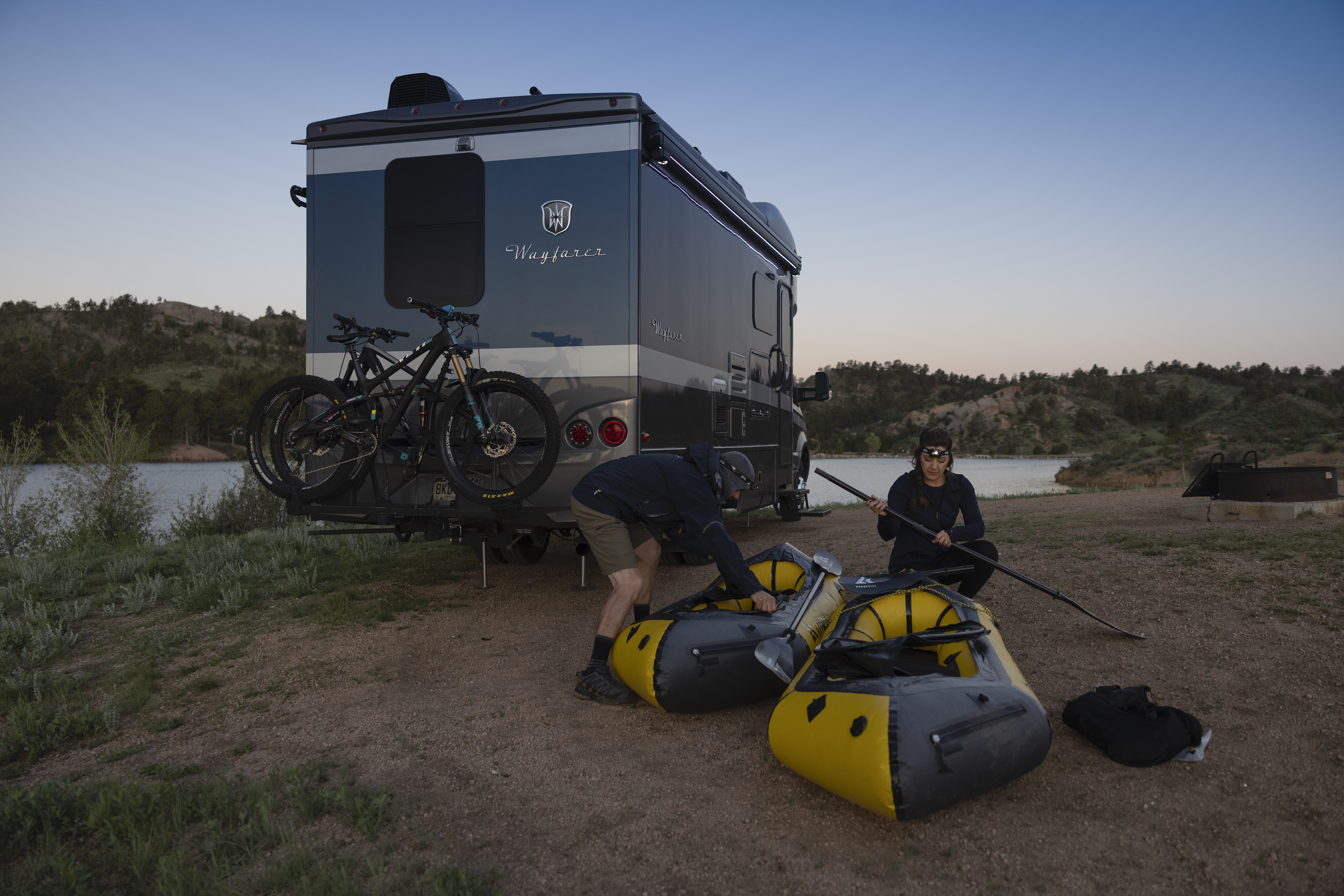 Dustin and Sarah preparing their packrafts in front of their Tiffin Wayfarer. 