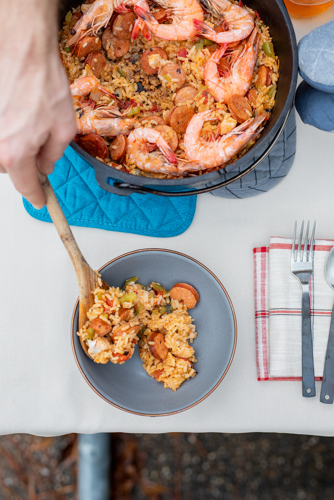 Serving up a bowl of jambalaya straight from the pot.  