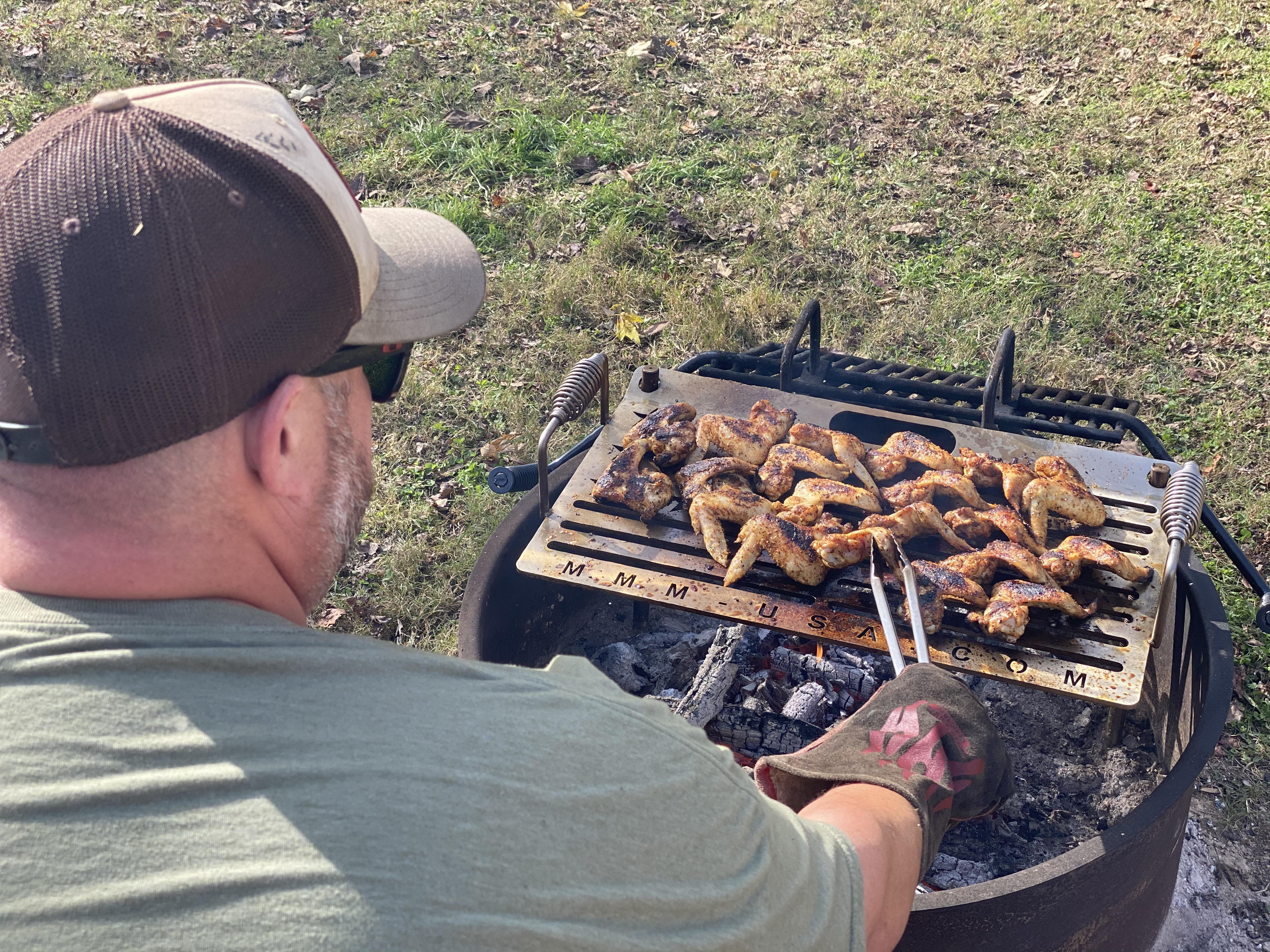 Abby Booth's husband grilling wings.