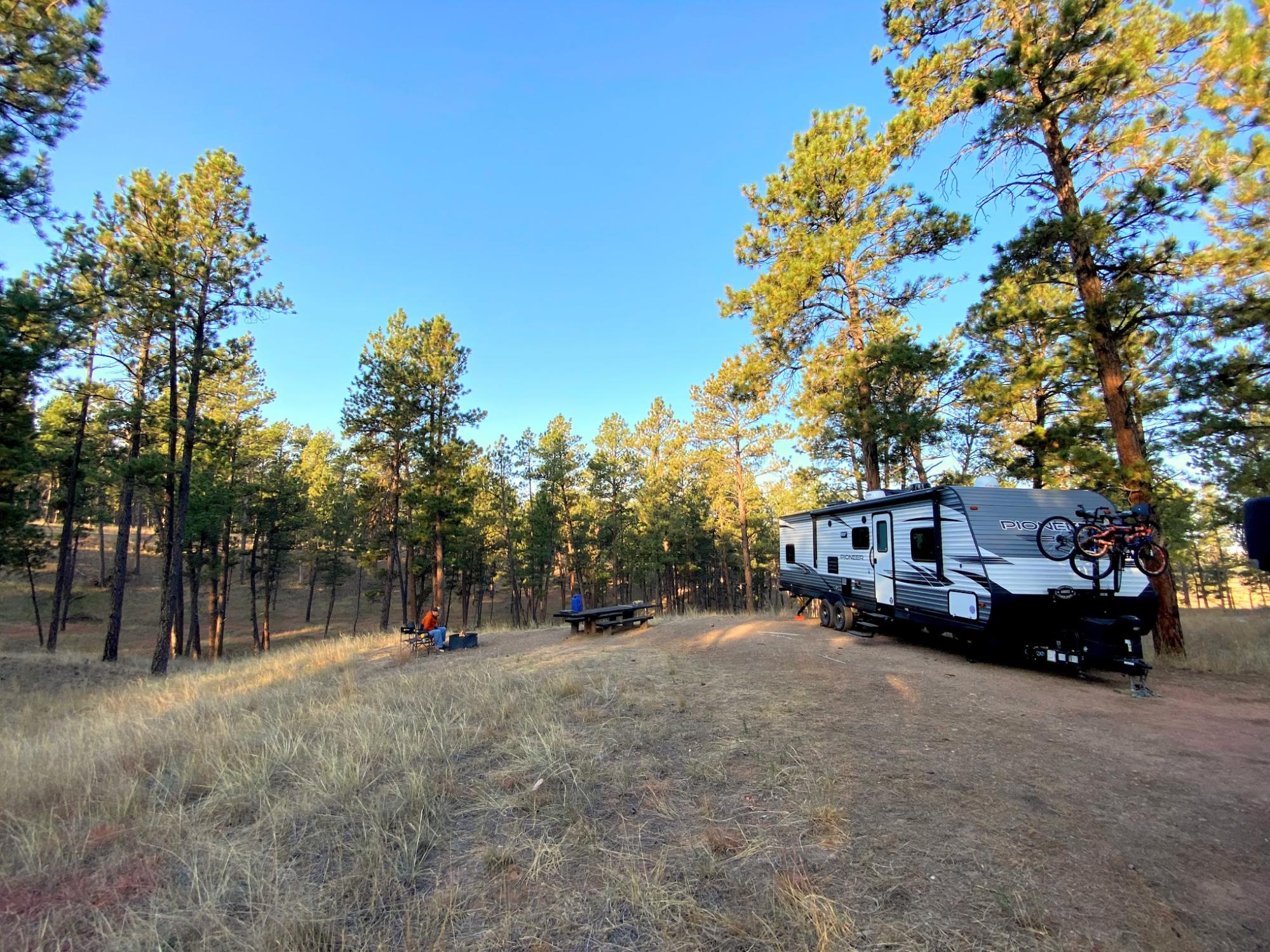 Abby Epperson's Heartland Pioneer parked at a campsite.