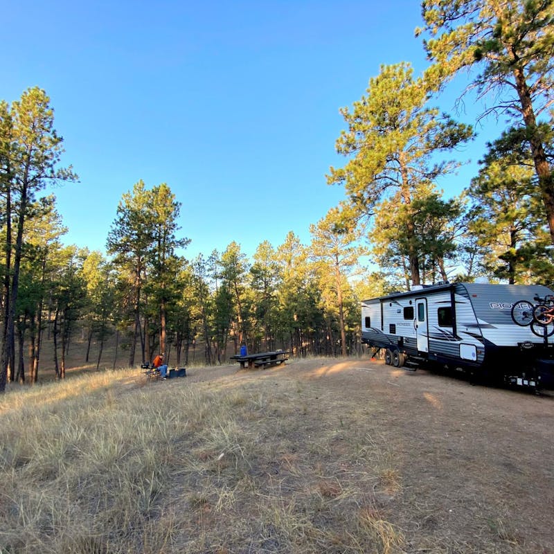 Abby Epperson's Heartland Pioneer parked at a campsite.