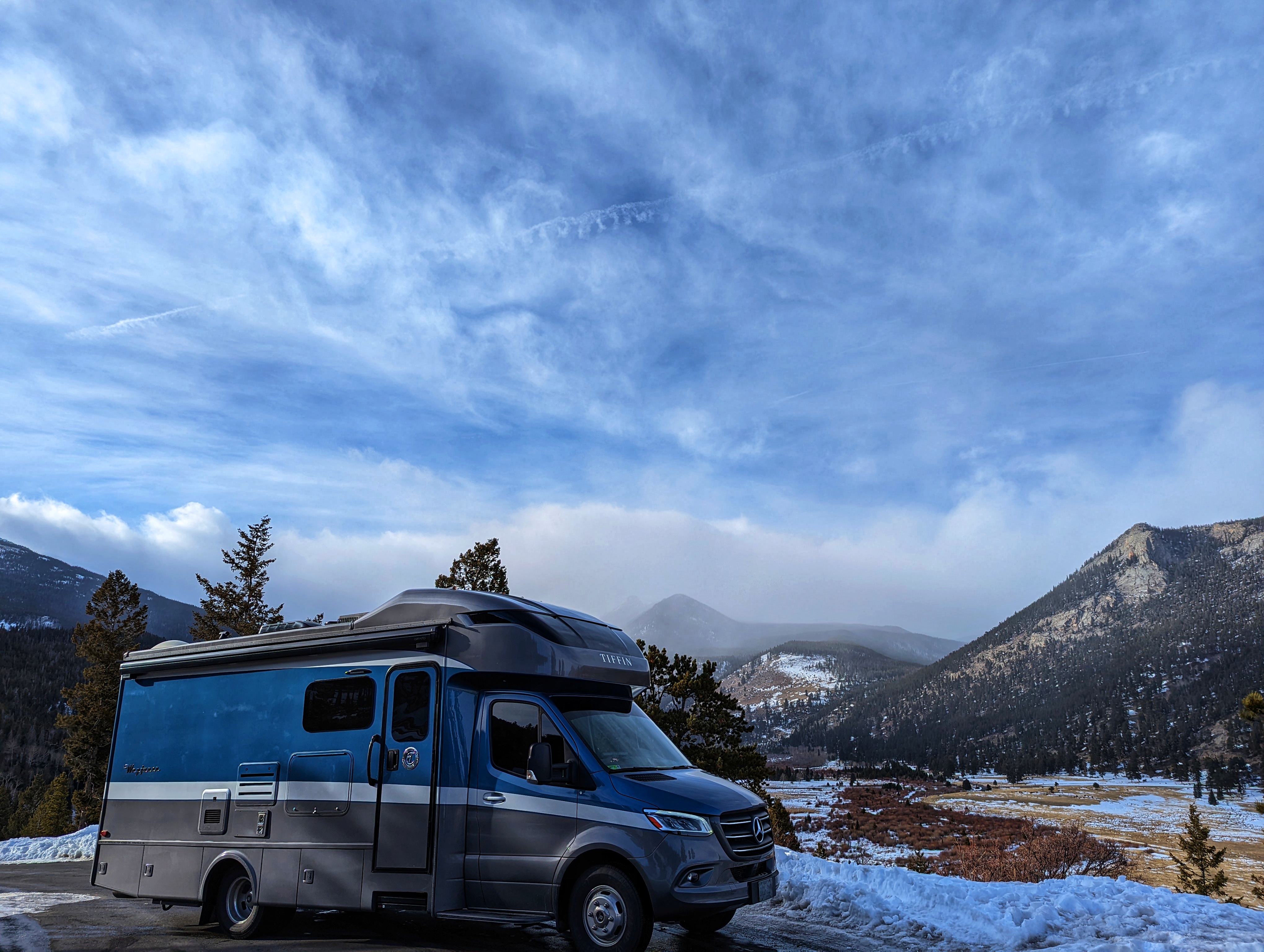Dustin and Sarah Bauer's RV parked near snowy mountains