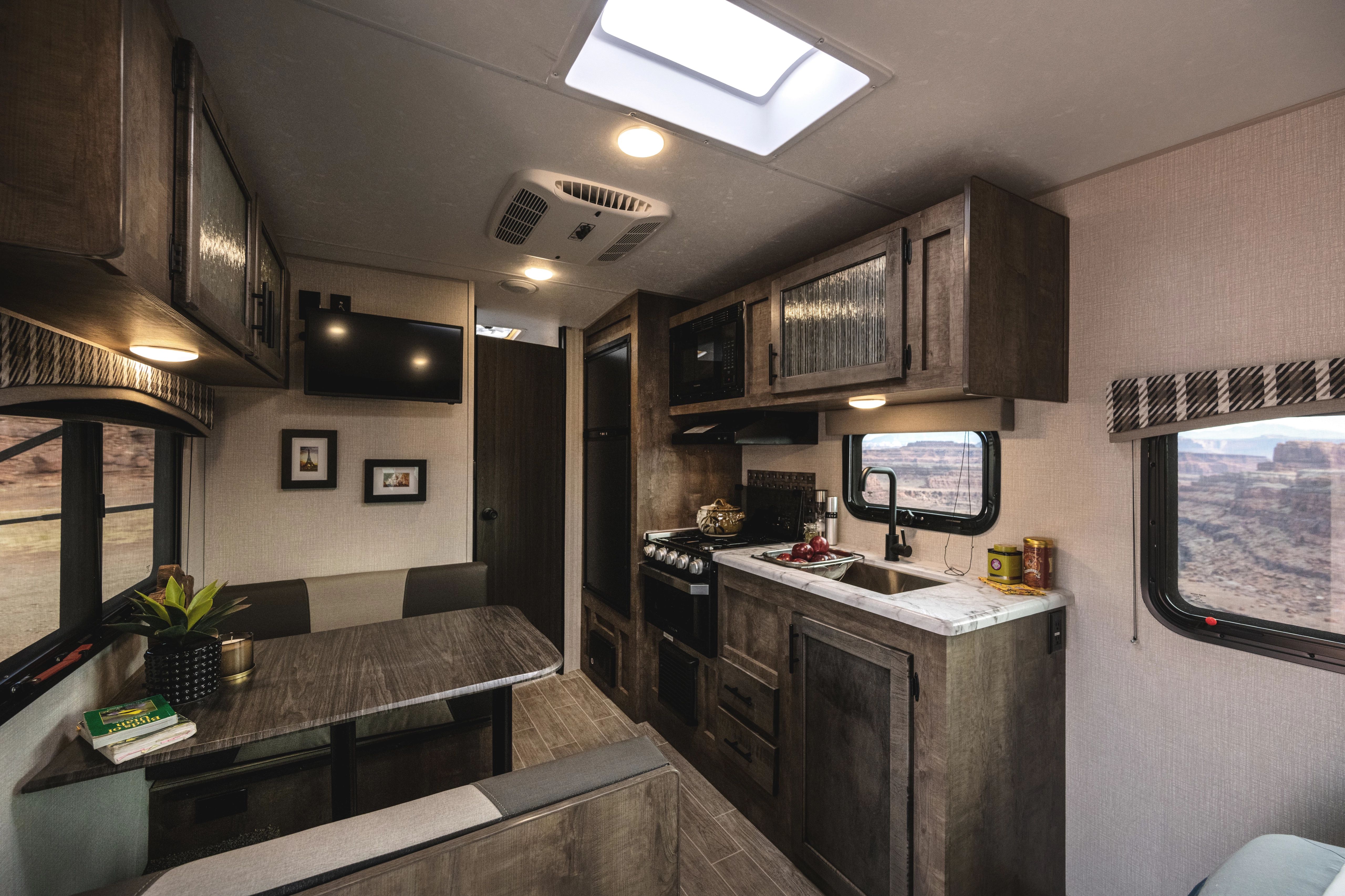 Interior kitchen and living area of a KZ Venture Sonic Lightweight Travel Trailer 