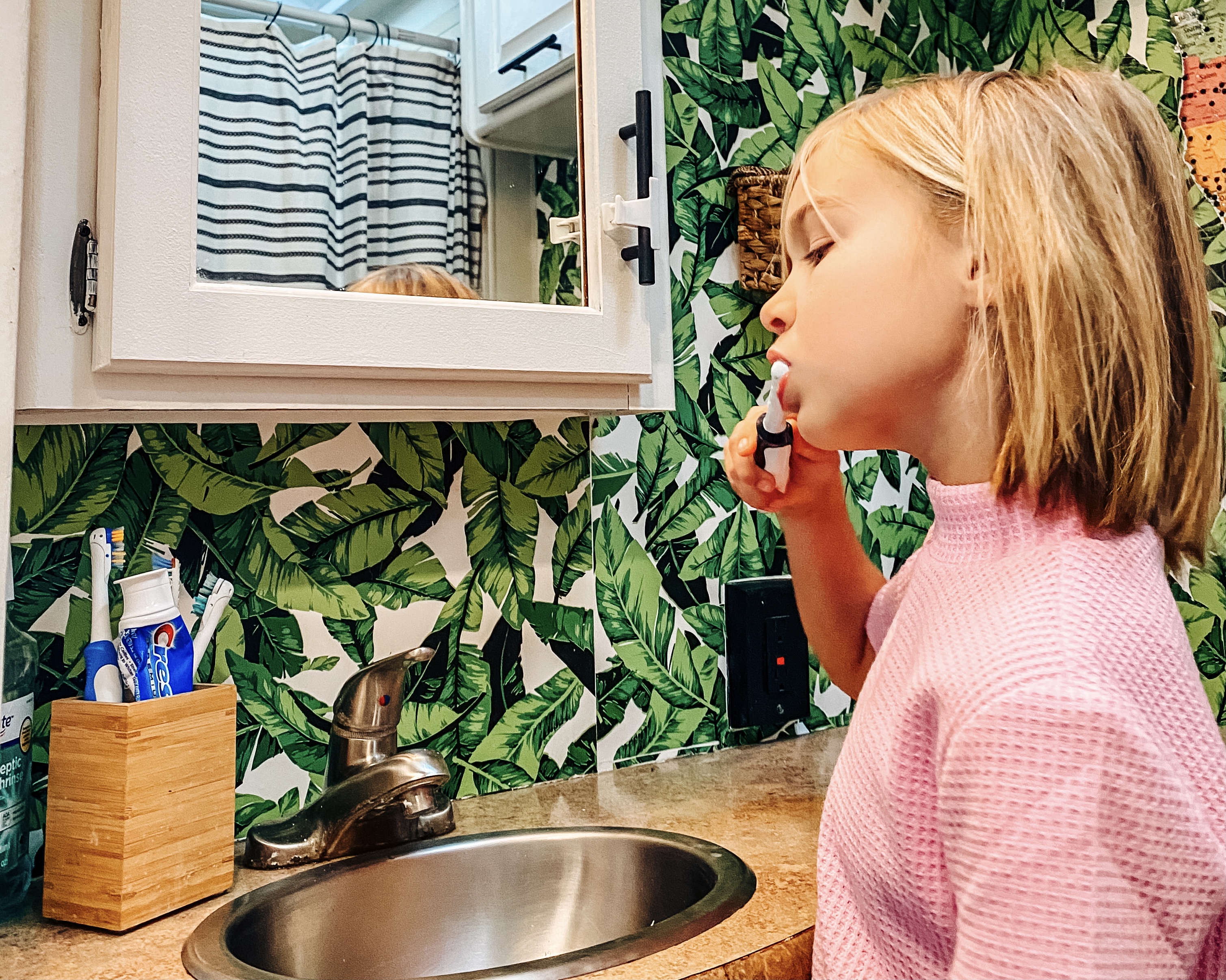 Justin and Michelle Russell's daughter brushing her teeth
