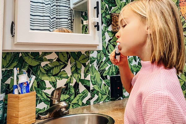 Justin and Michelle Russell's daughter brushing her teeth