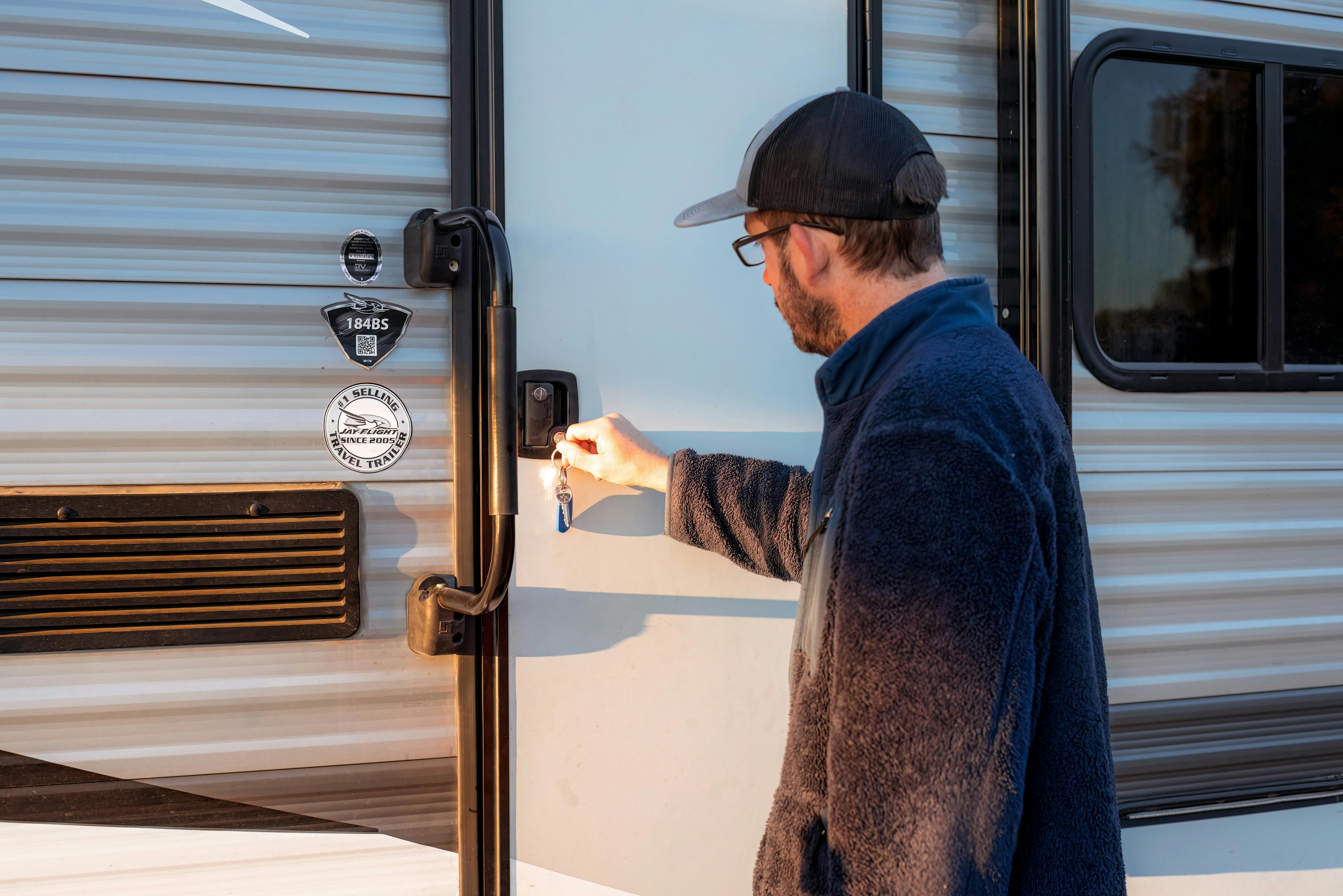 Jason Takacs' locking the door to his Jayco Jay Flight