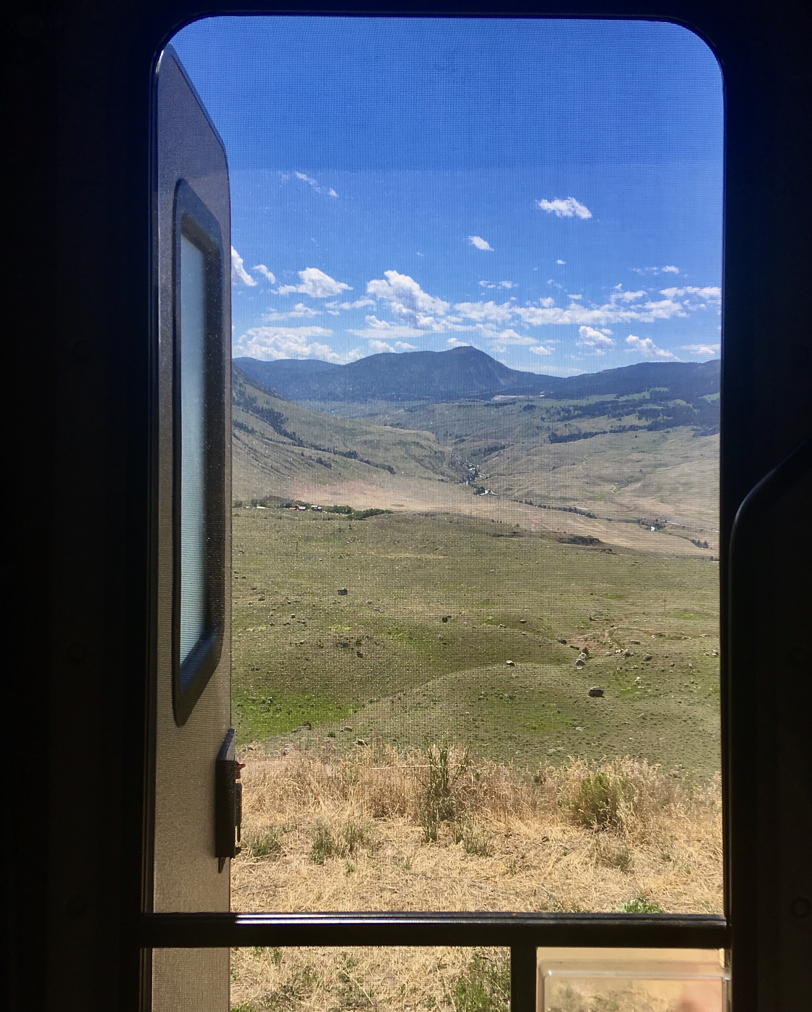 A view out an RV window to Yellowstone National Park. 