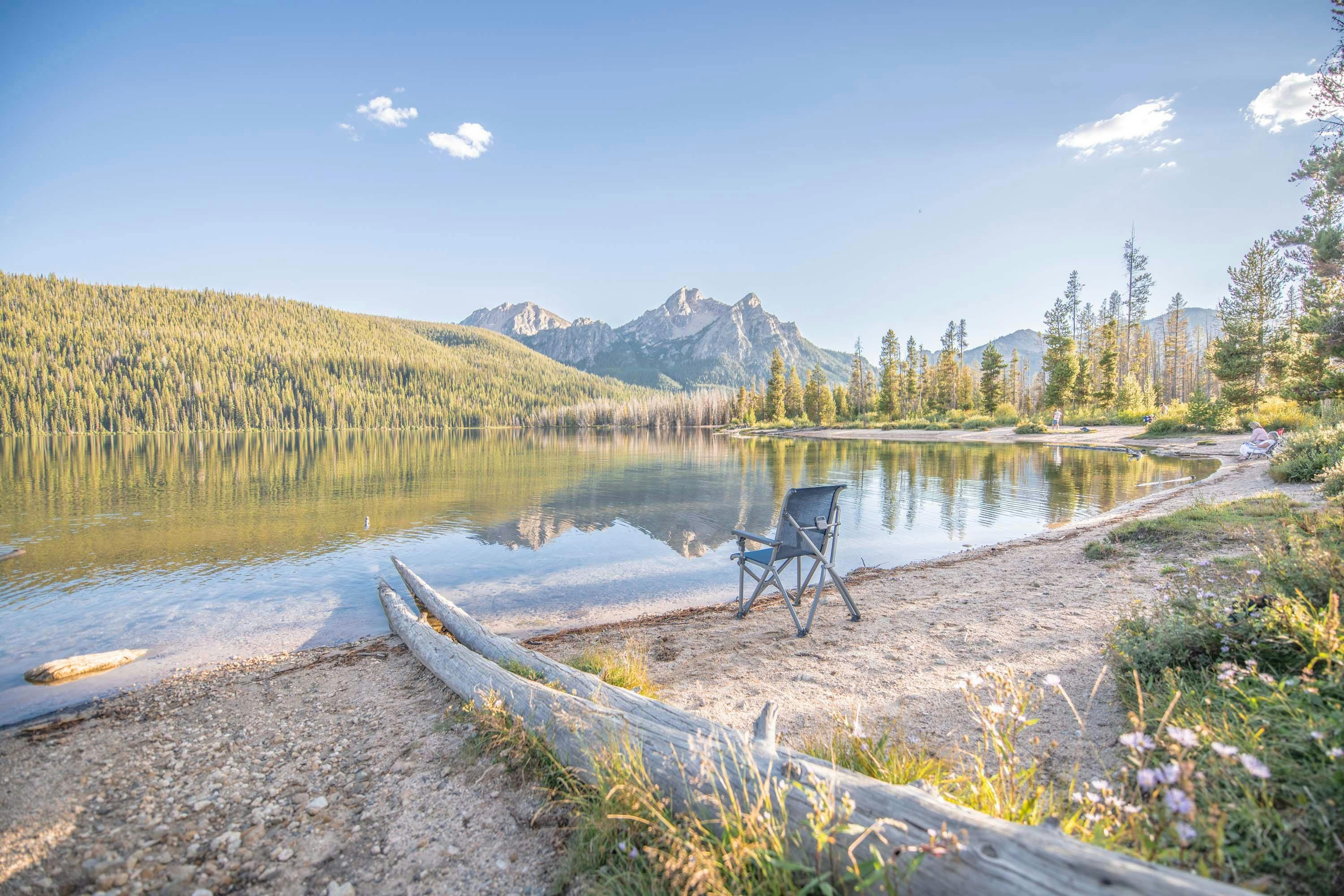 A lake overlooking the mountains at Sawtooth National Forest, captured by Chelsea Day