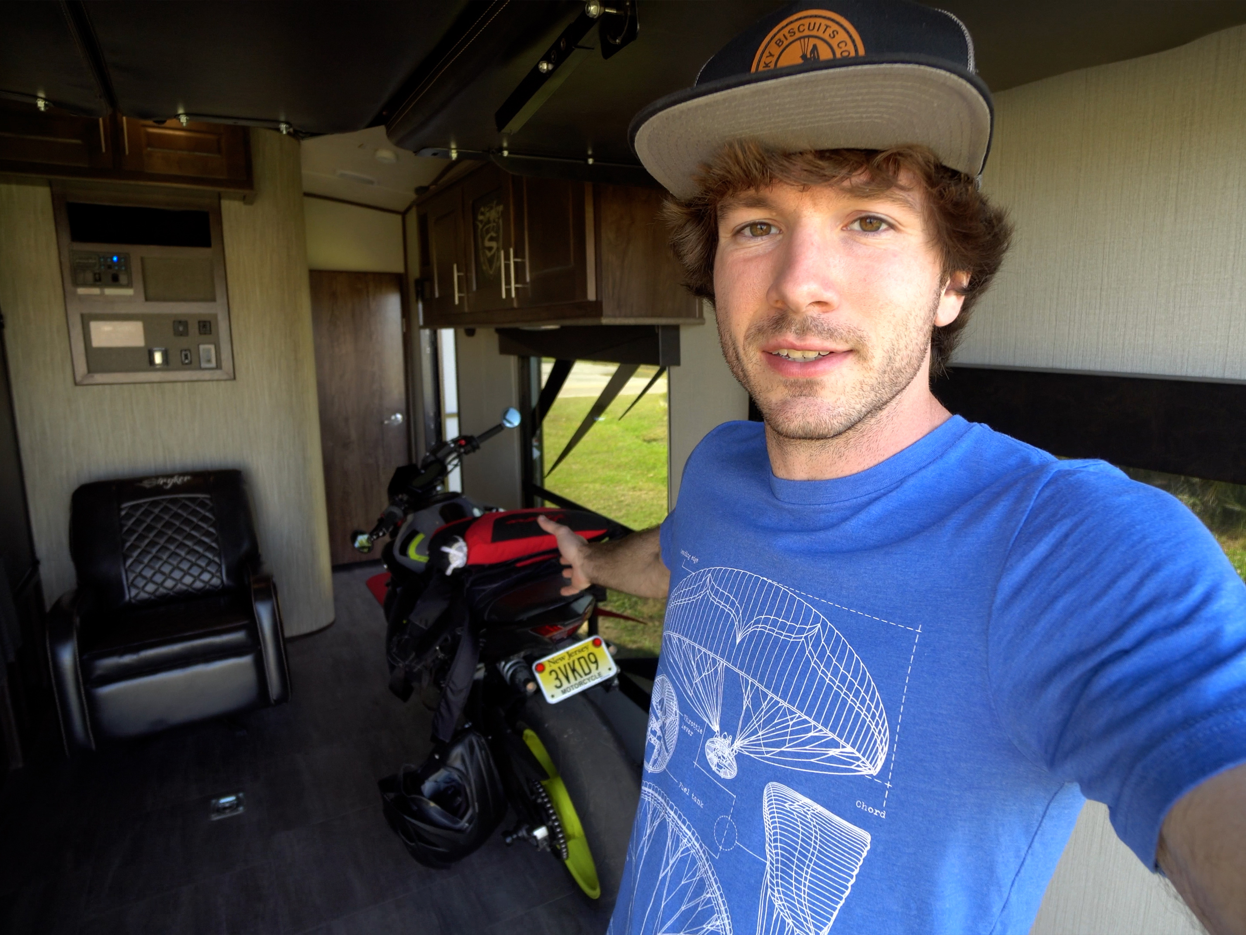 Tucker Gott takes a selfie inside the garage of his Cruiser Stryker RV.