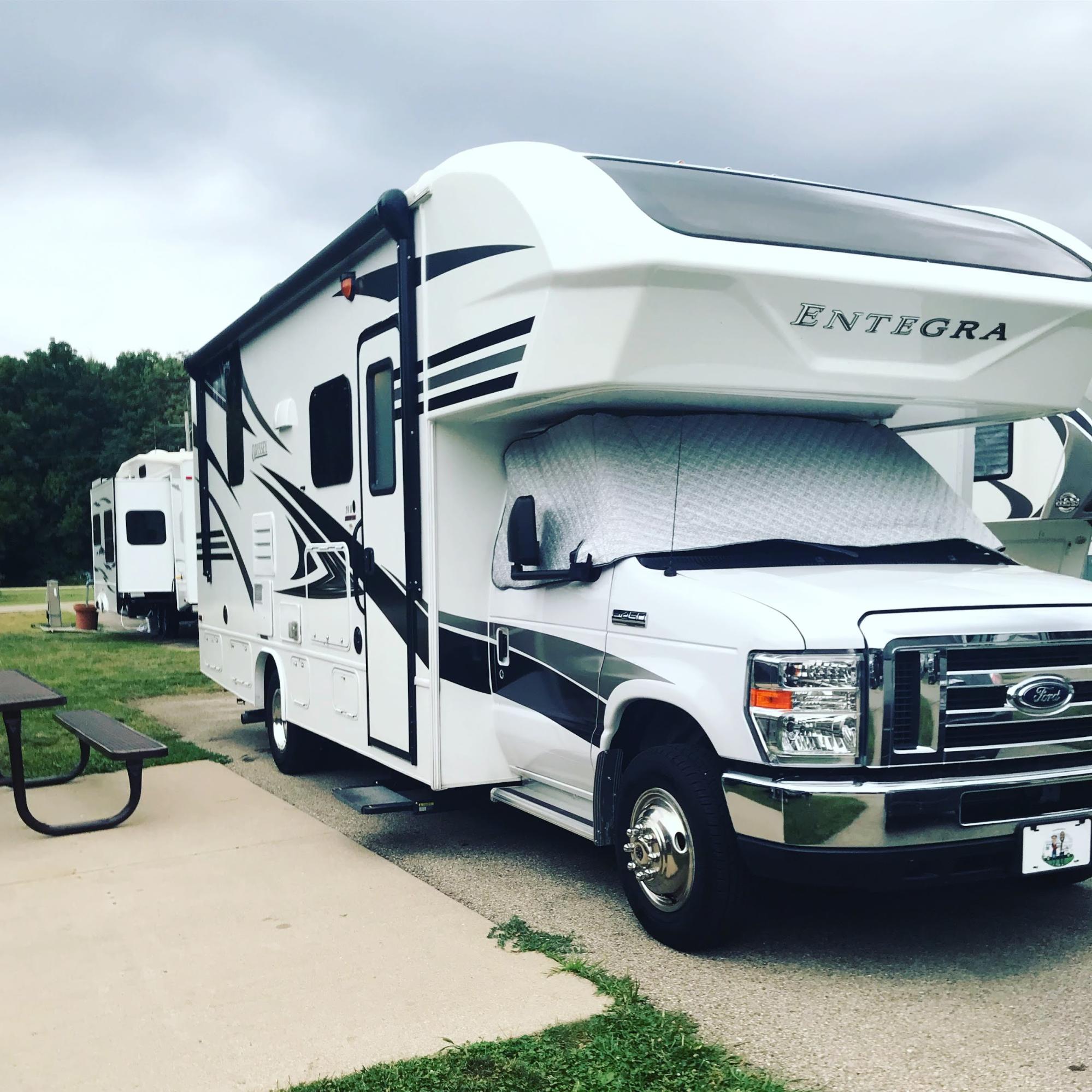 Kirsten and Mack Womack's Entegra Class C RV parked at an RV park. 