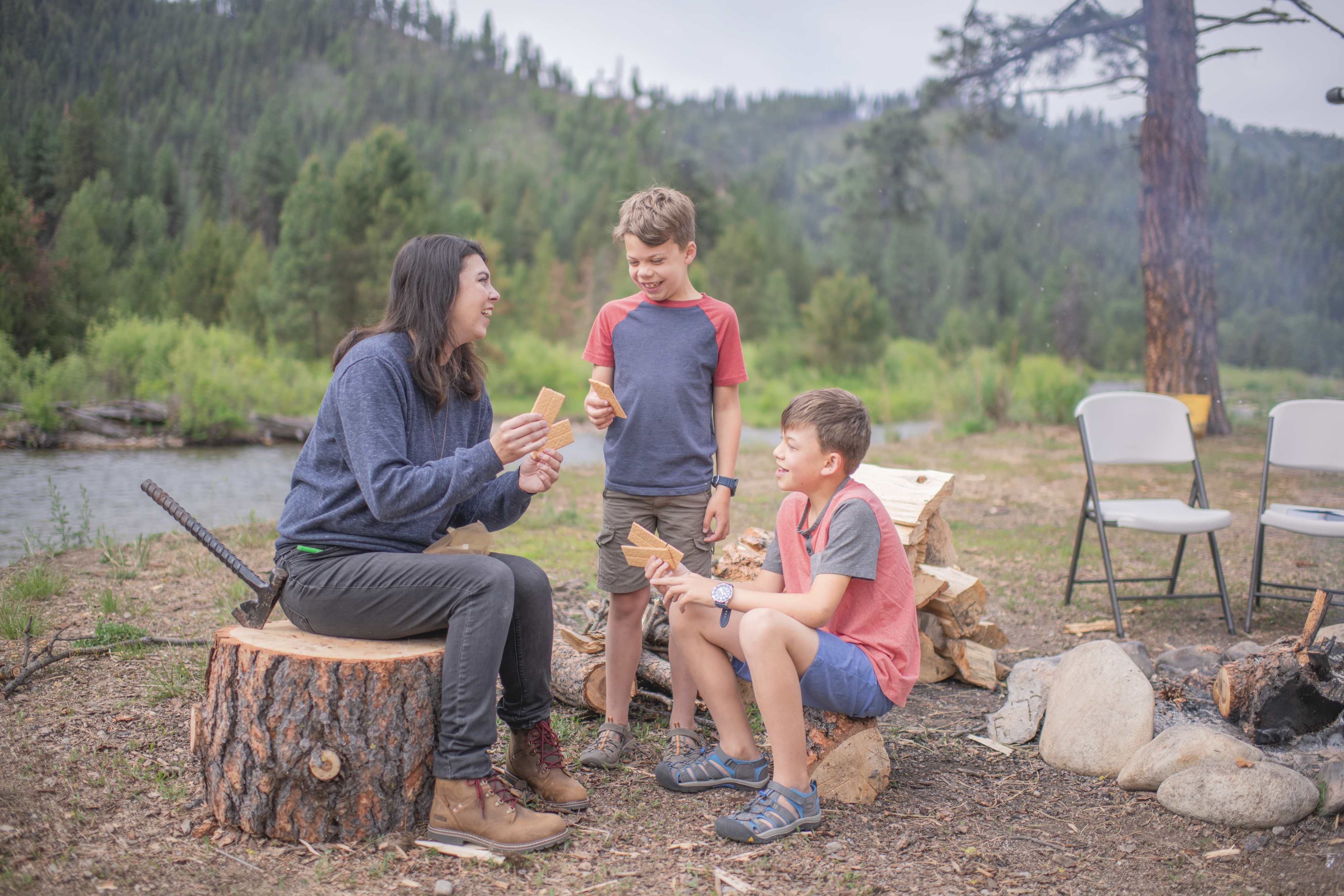 Chelsea day teaching a math lesson to her children using graham crackers
