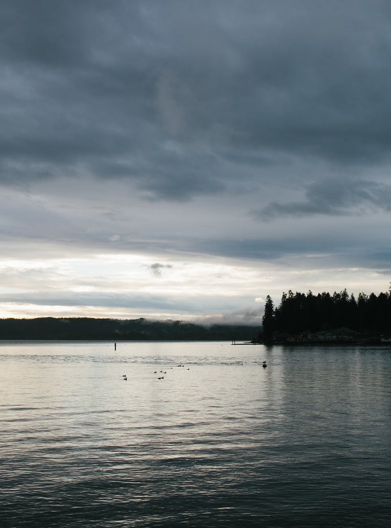A cloudy sky over a calm lake. 
