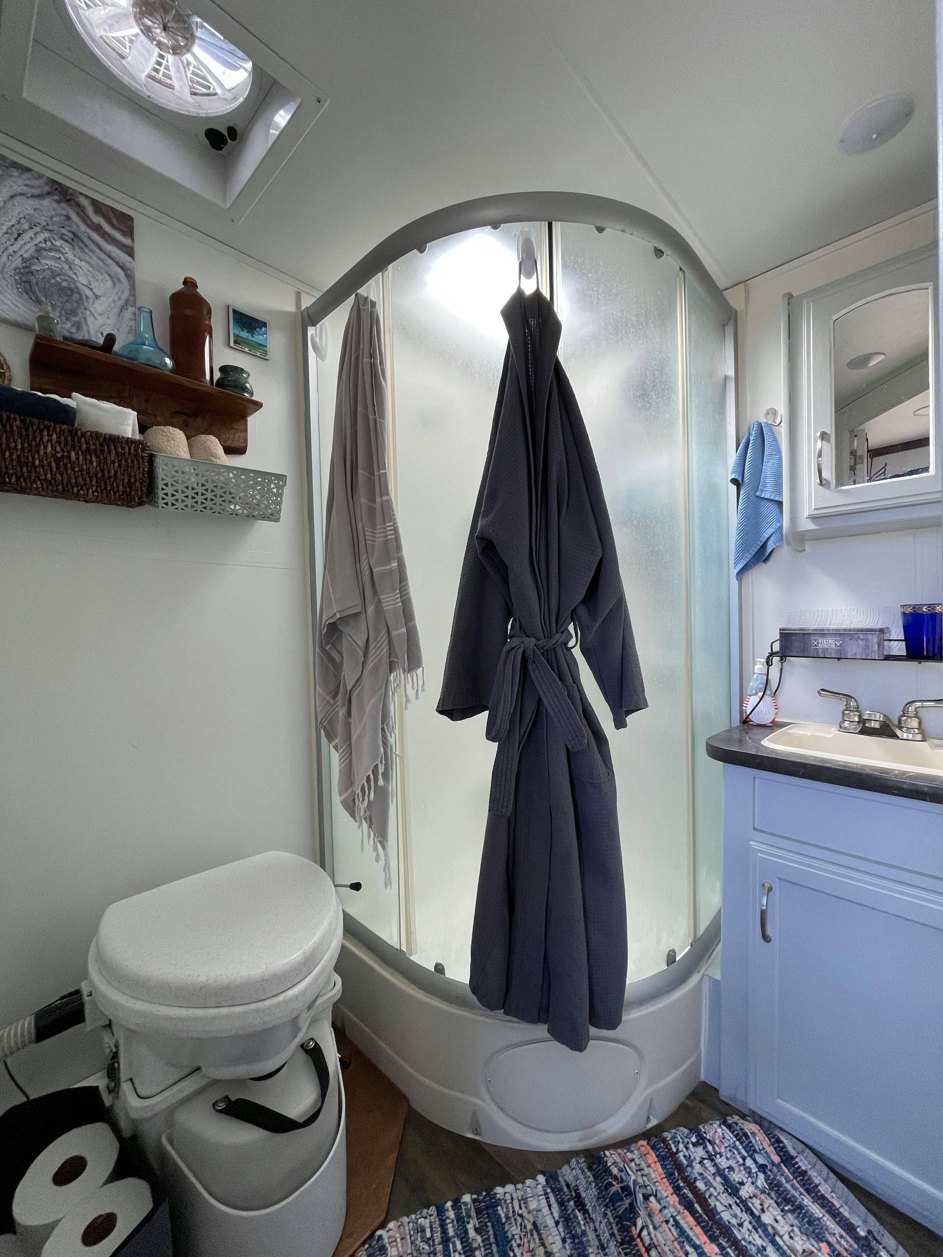 Ben and Christina McMillan's bathroom featuring a composting toilet and shower